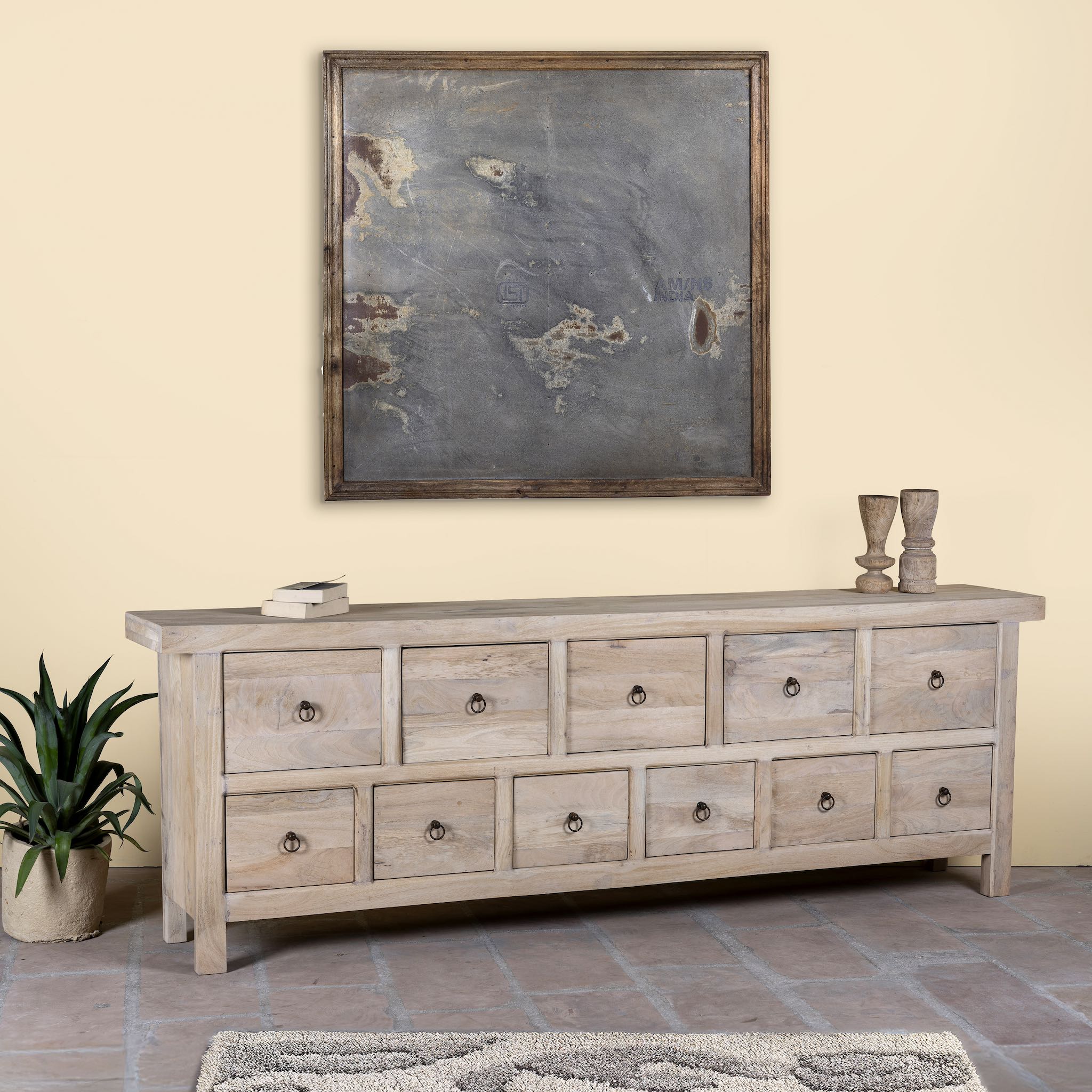 Side angle image of a reclaimed wood furniture chest of drawers with 11 drawers, Ibiza style living room furniture with sandblasted finish, 250 × 40 × 85 cm.