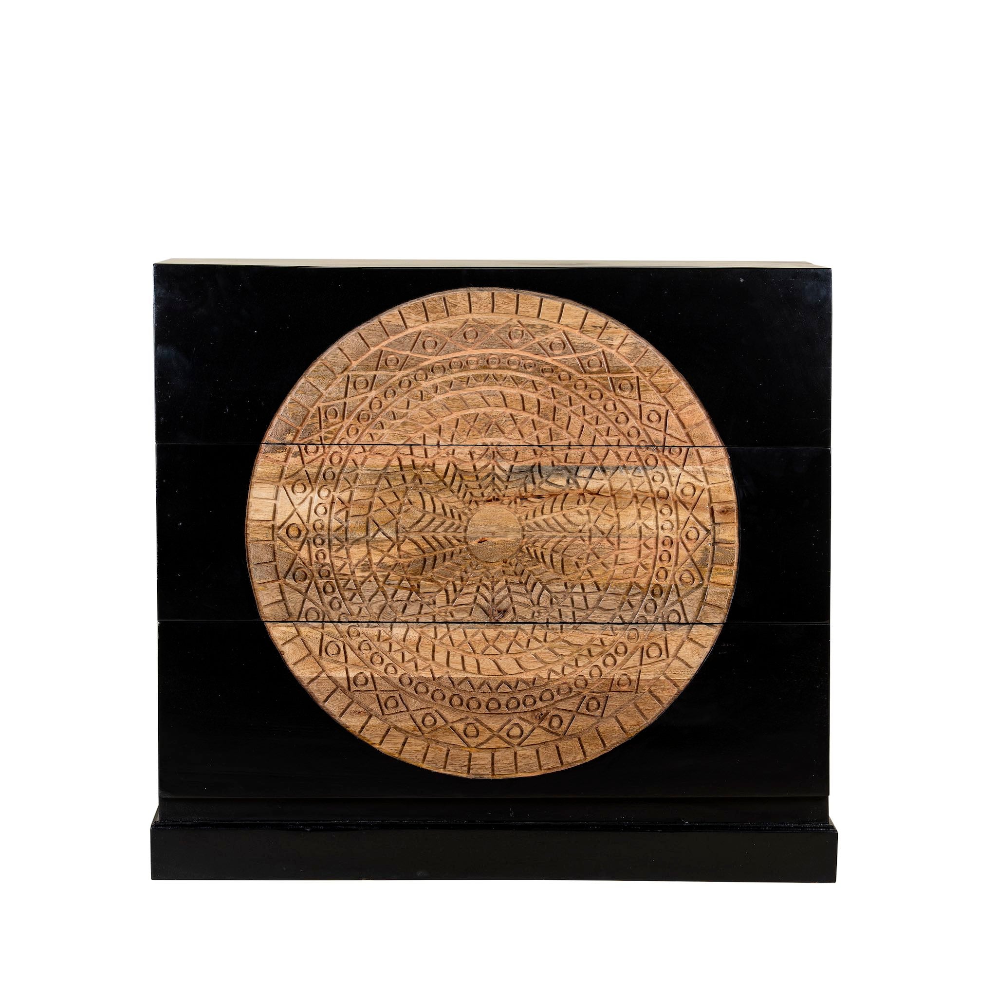 Mango wood drawer chest with black finish and large circular floral hand-carving on the front.