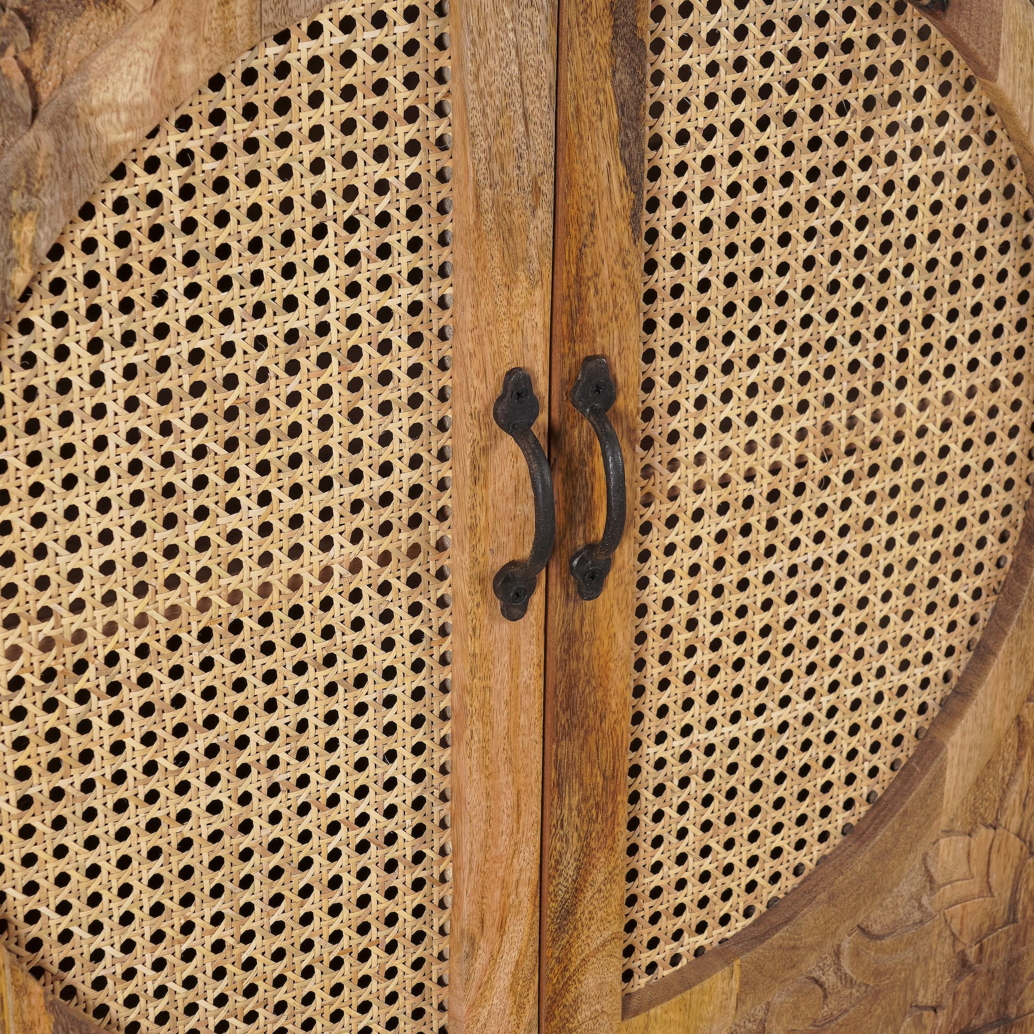 Close up image of the rattan inserts of handcrafted mango wood cabinet Agnayi with rattan inserts and floral carvings, rattan furniture for bohemian interior, 80 × 40 × 148 cm.