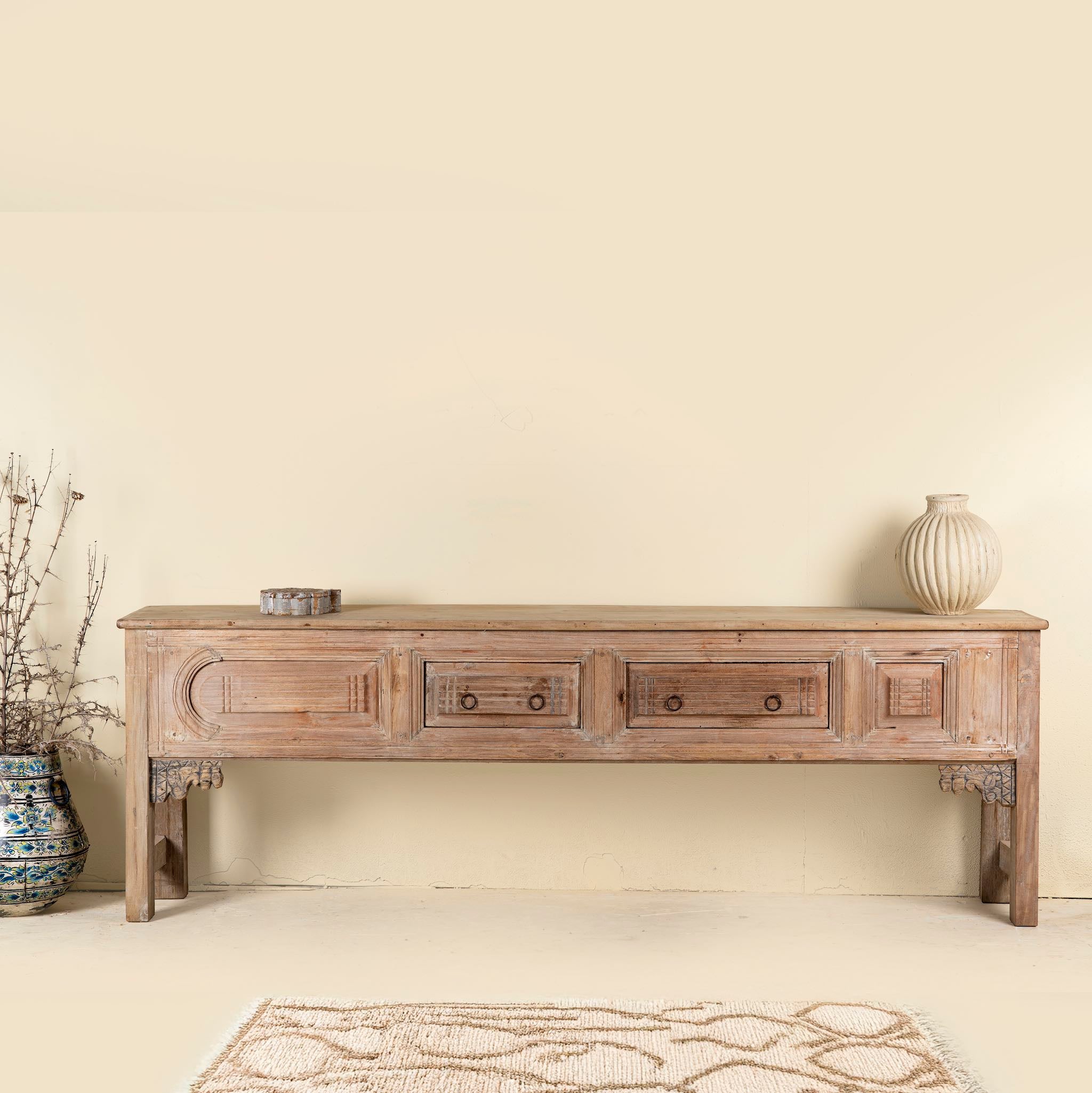 Akhilesh carved console table made from reclaimed teak, a striking piece of unique wooden furniture.