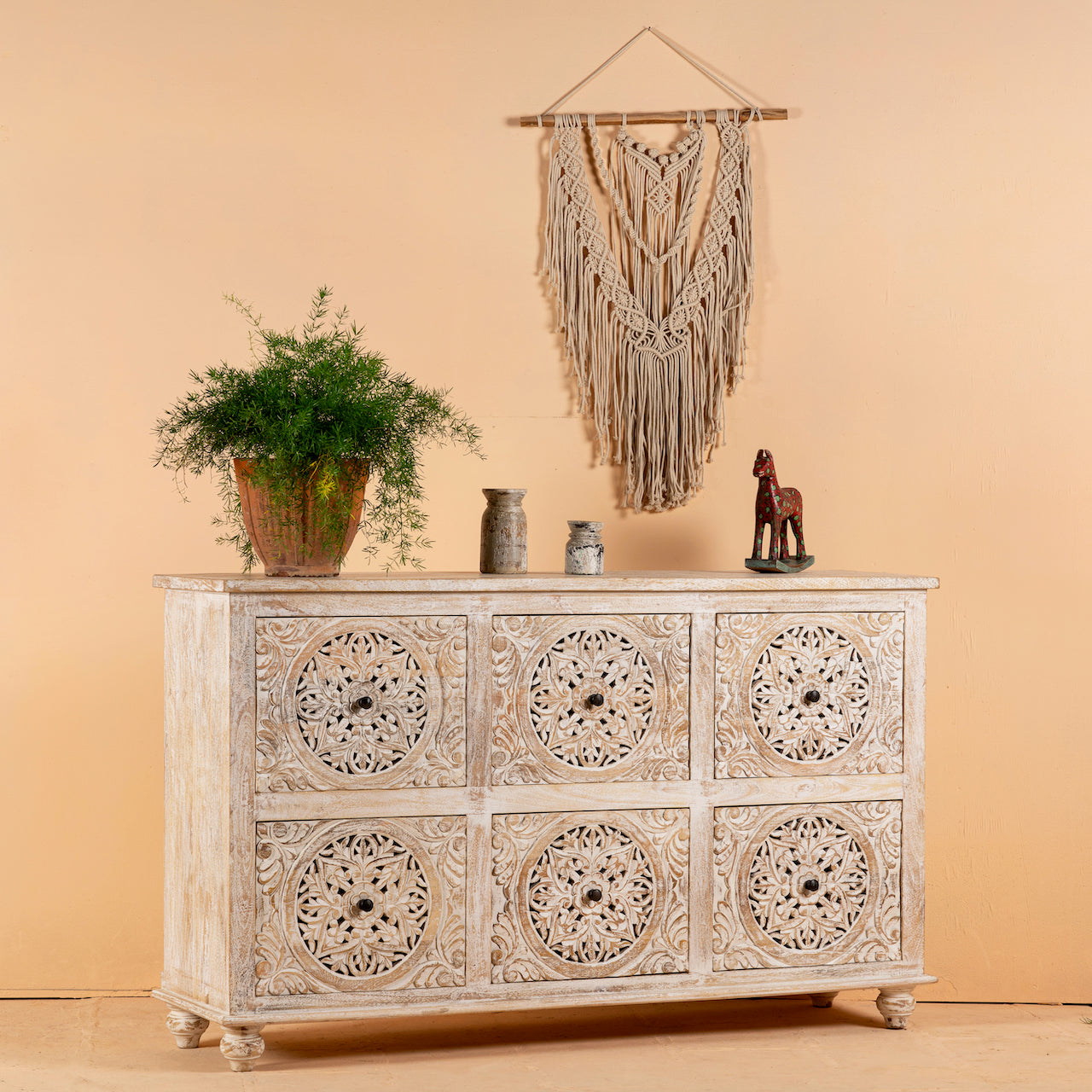Side angle image of a hand-carved mango wood sideboard with Mediterranean drawer motifs and whitewashed finish; ideal carved sideboard or entryway table vintage, 150 × 90 × 40 cm.