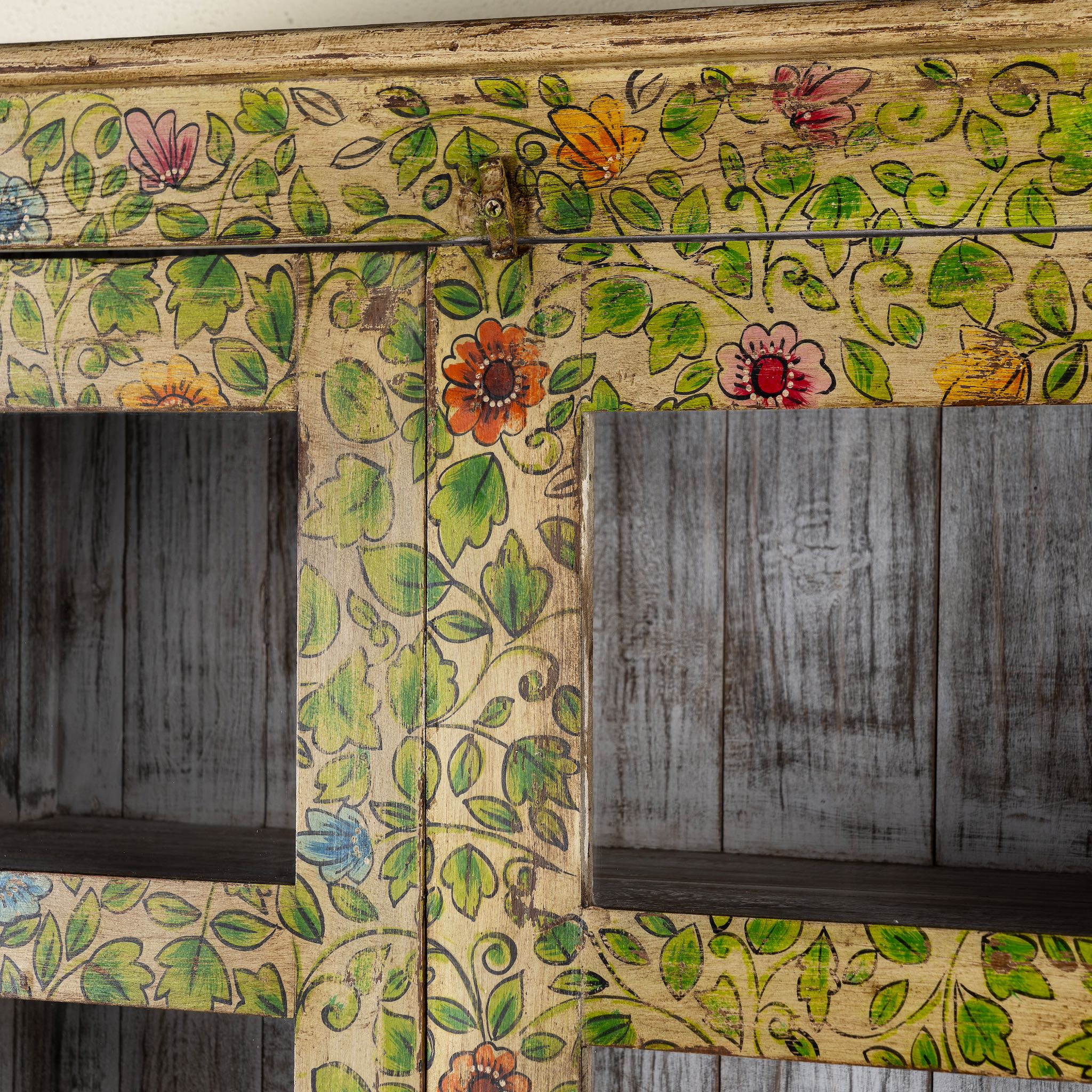 Close up image image of a hand-painted reclaimed wood showcase cabinet with floral motifs and glass doors, sustainable furniture and vintage home decor style, 96 × 40 × 182 cm.