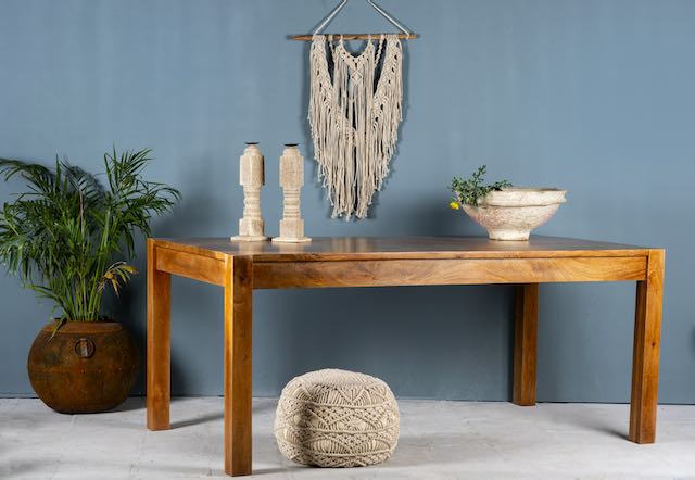 Side angle image of a rectangular solid wood dining table crafted from reclaimed teak; minimalist style reclaimed wood dining table, 180 × 100 × 77 cm.