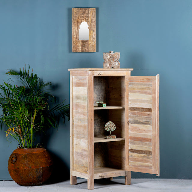 Open door image of a reclaimed teak wood cabinet with slatted door and sandblasted finish, Ibiza-style, 122 × 56 × 40 cm.
