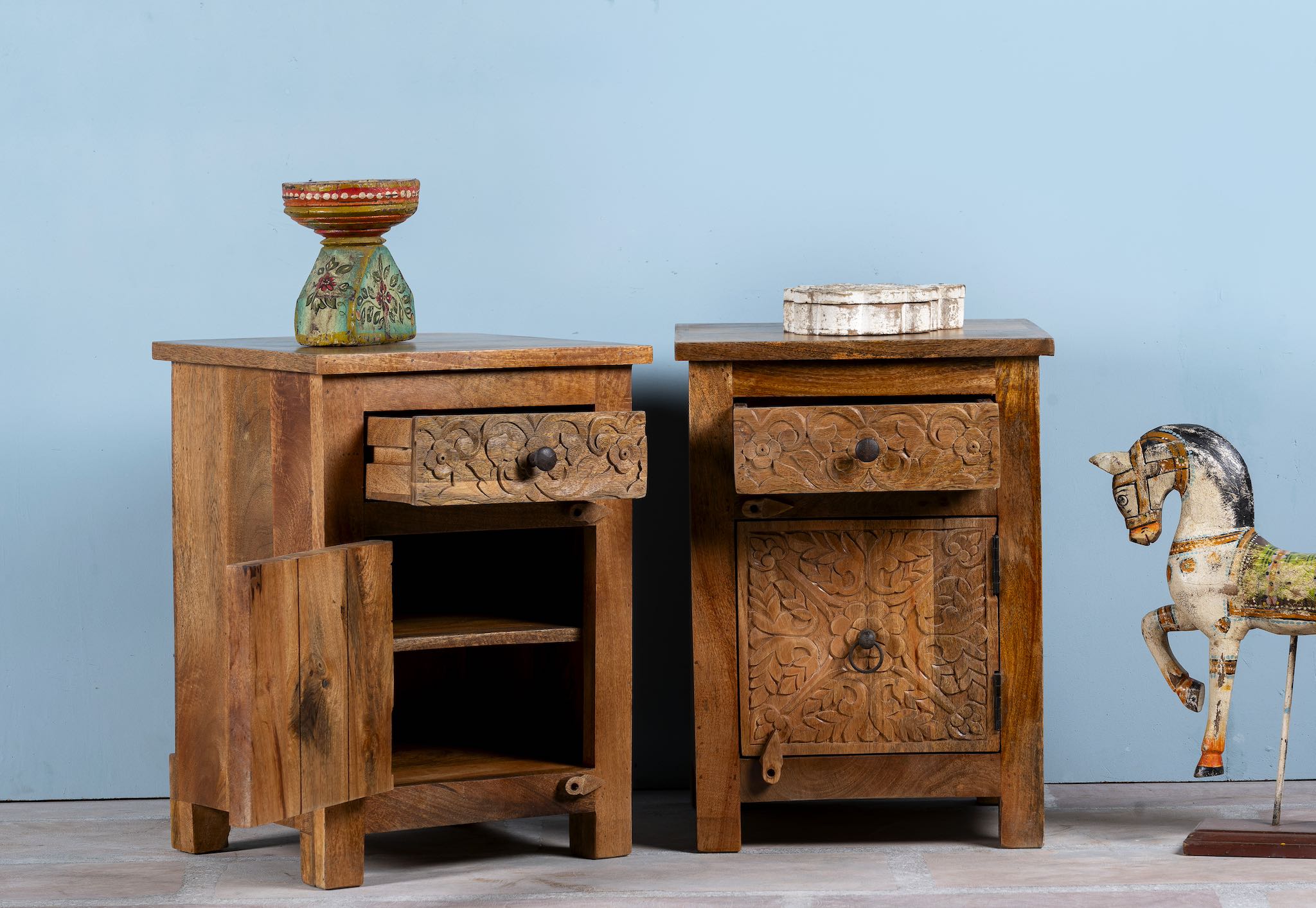 Open drawer image of a hand-carved mango wood bedside tables with floral motifs – a set of carved wooden furniture perfect for rustic and relaxed interiors.