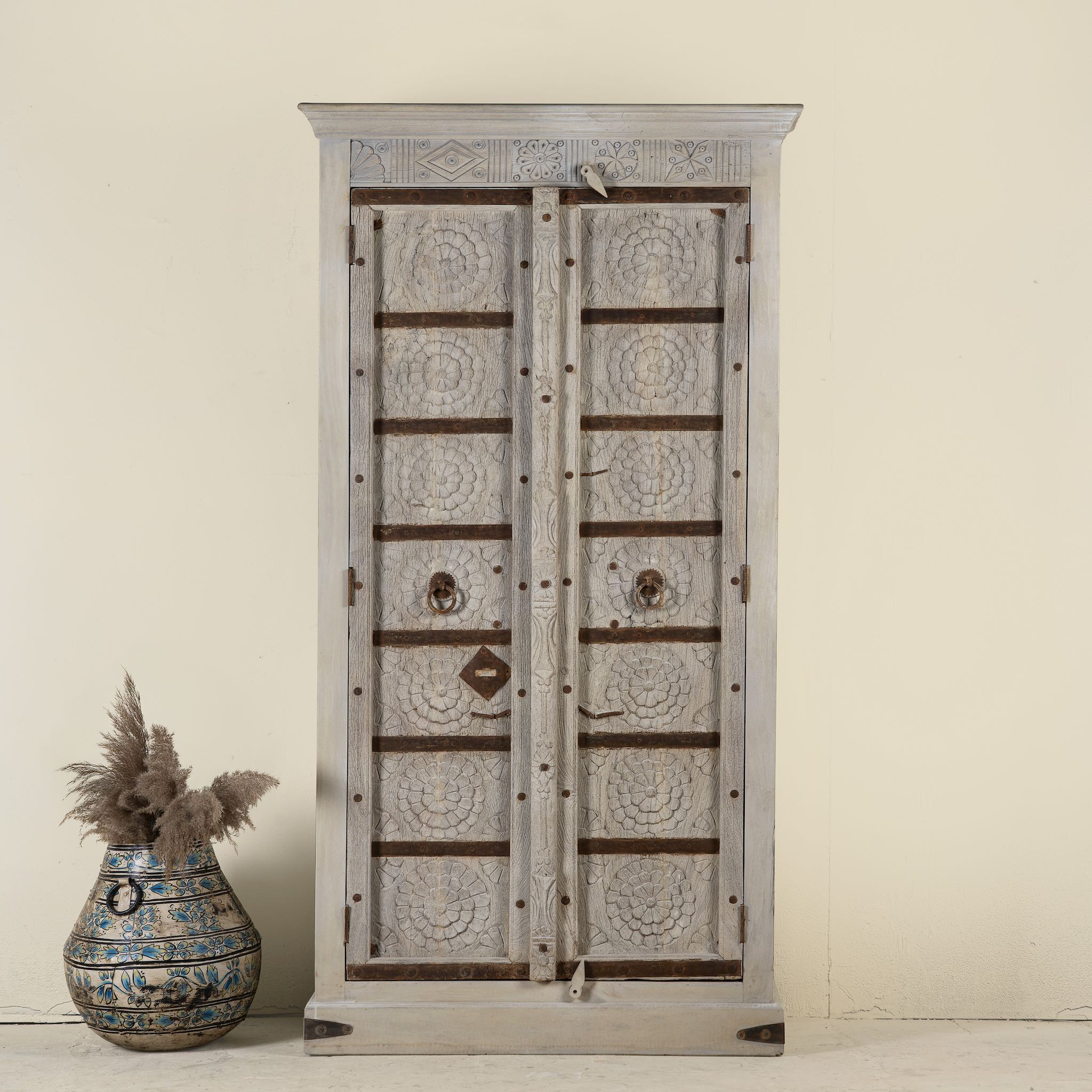 Old door cabinet with reclaimed teak doors, floral carvings, and iron accents; artisan teak wood wardrobe with mango wood frame, 100 × 44 × 206 cm.