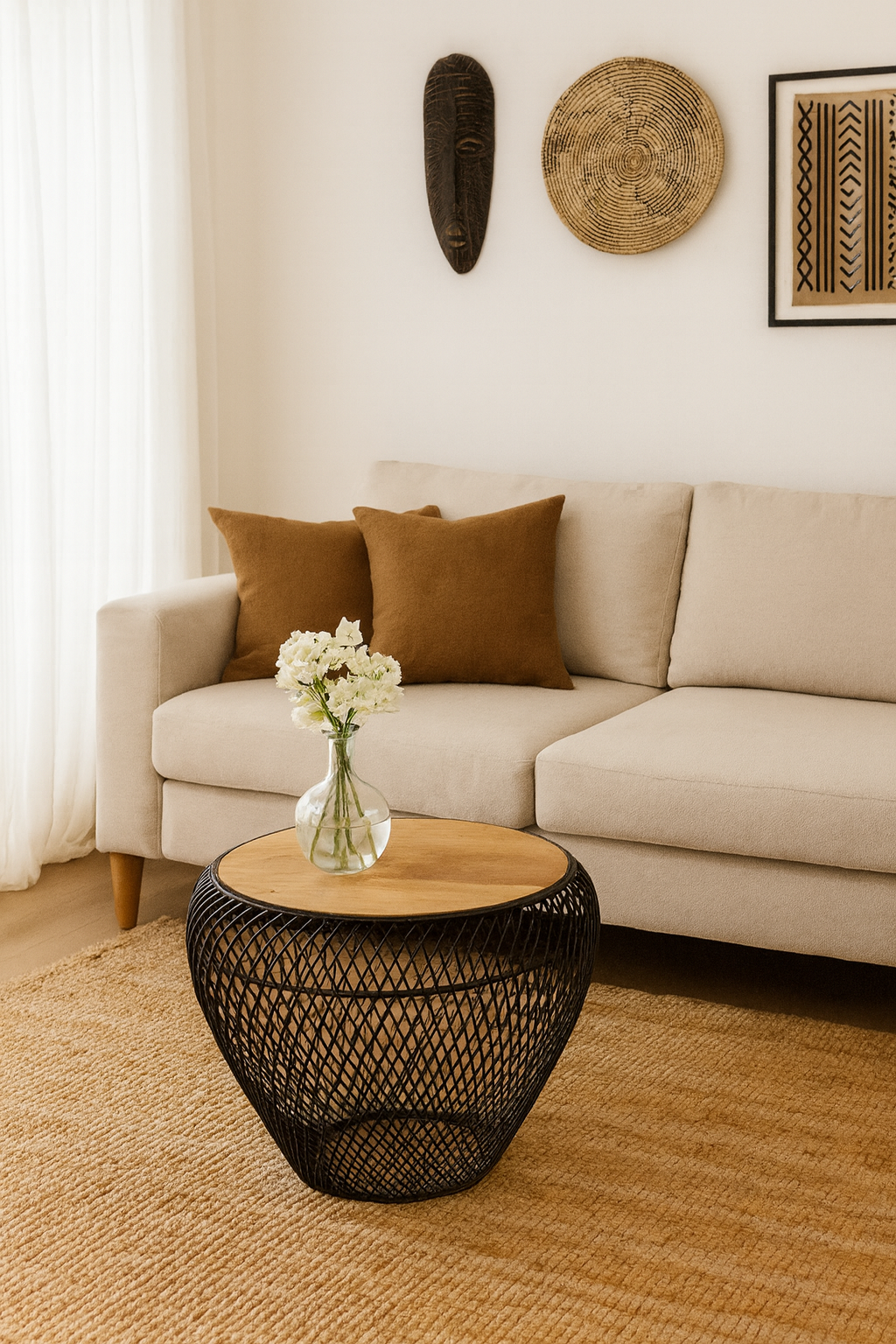 Lifestyle imagination of a round metal base coffee table with recycled wooden top and woven iron frame; minimalistic style coffee table, 58 cm diameter, 45 cm height.
