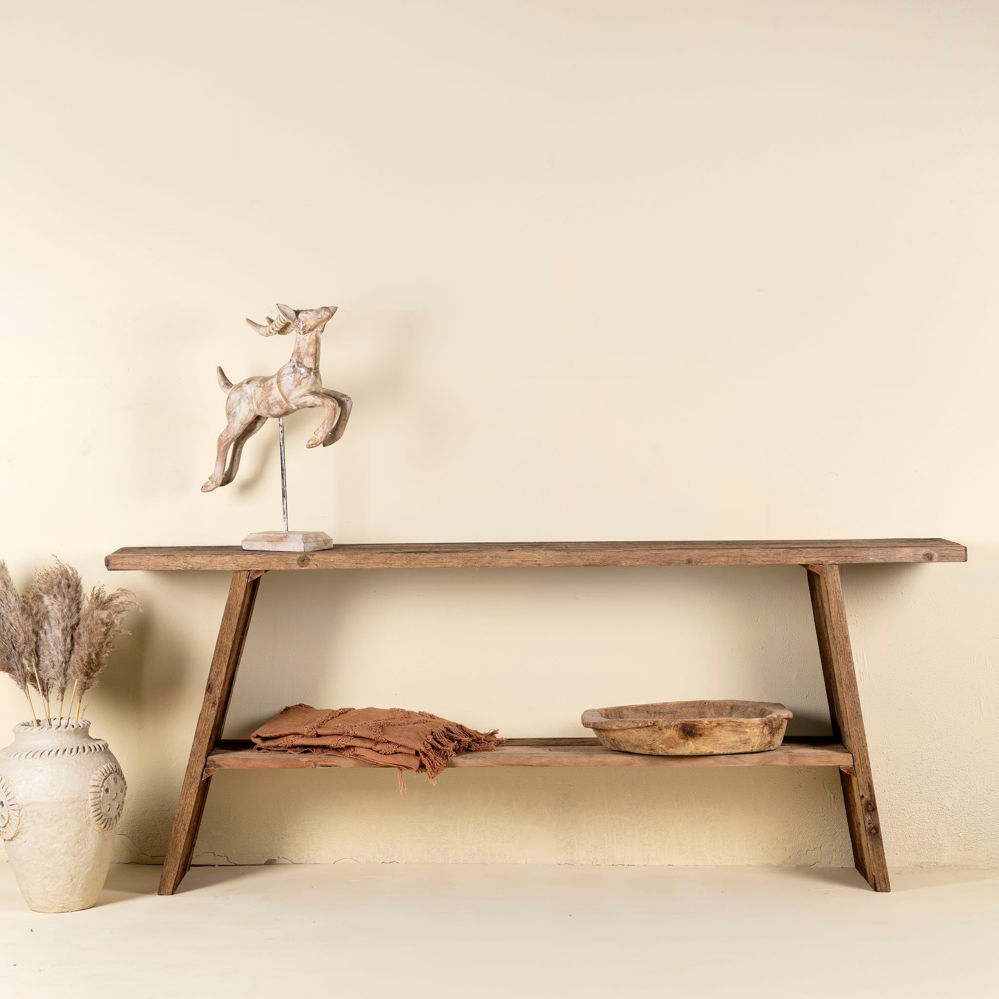 Driftwood console table made from reclaimed wood, with lower shelf and weathered finish; sustainable furniture for entryways, 200 × 32 × 80 cm.