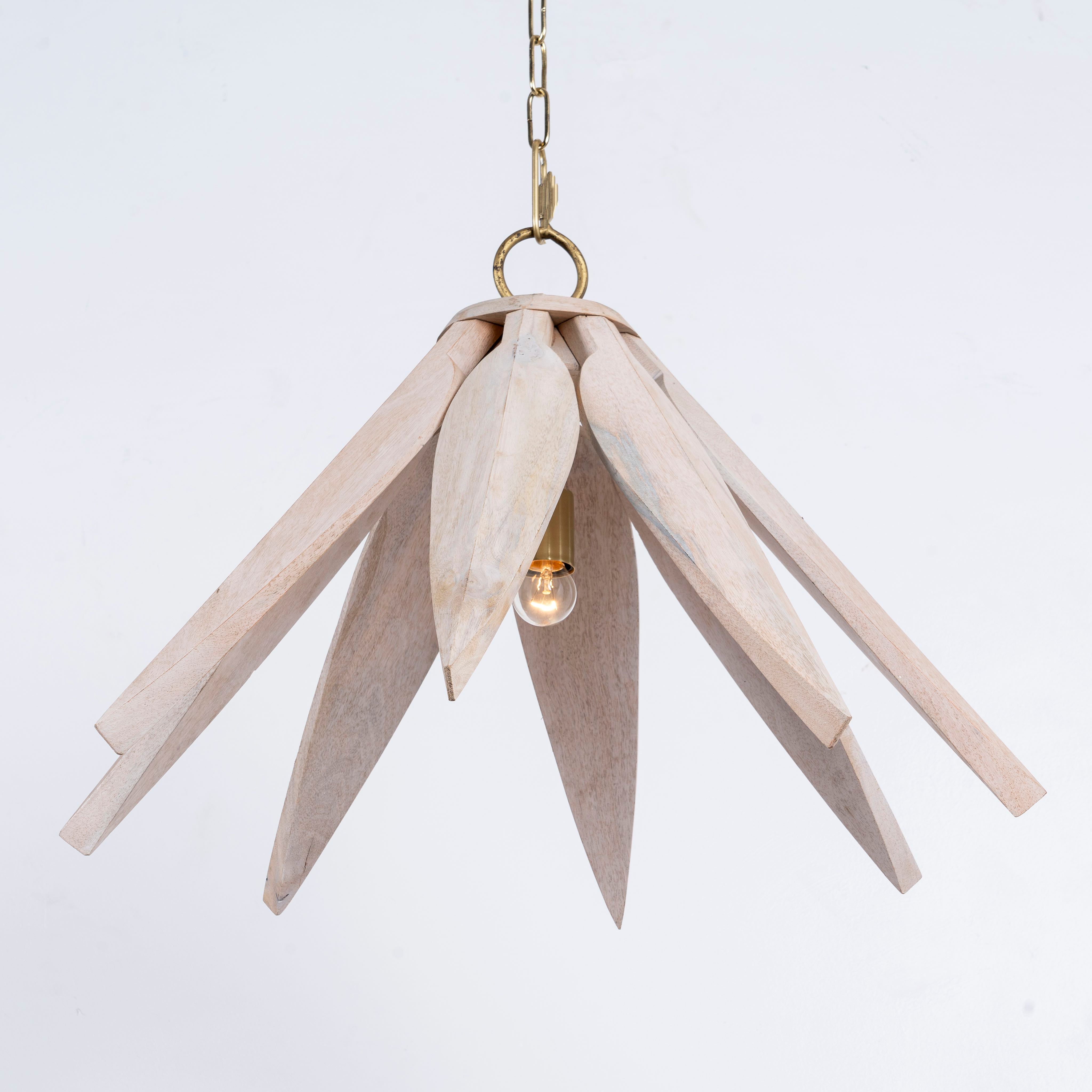 Side angle image of a vintage pendant lamp made from white-washed mango wood in a floral design, suspended by a brass-plated hanger – elegant mango wood lighting for bedrooms, living rooms, or dining areas.
