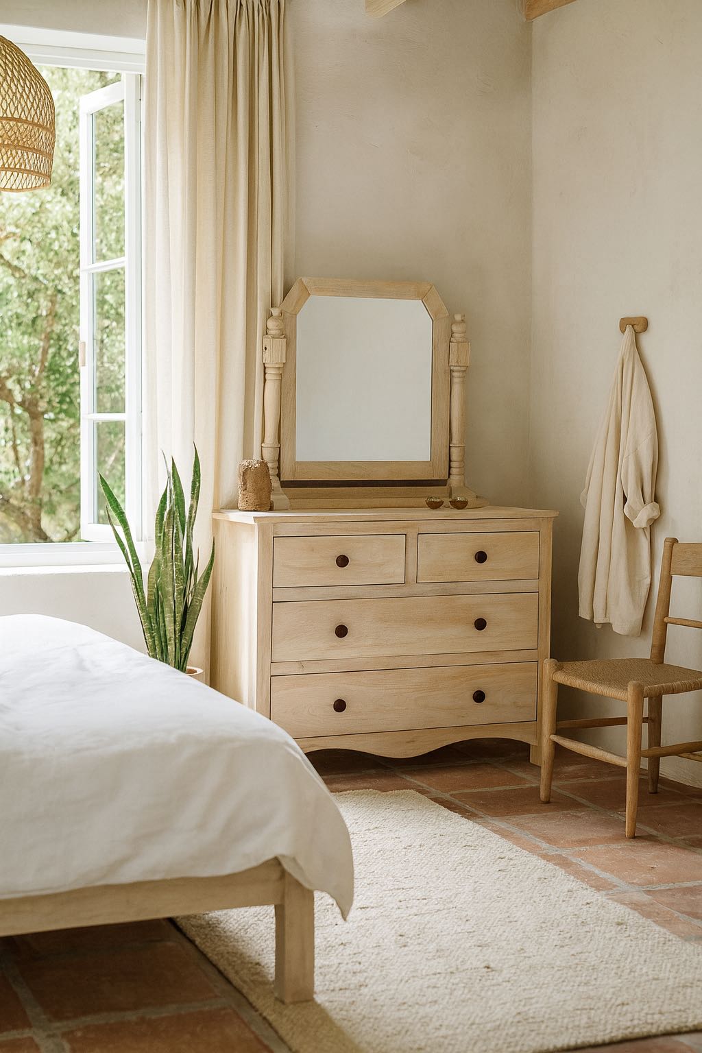 Lifestyle image of a Ibiza style Mango wood dressing table with five drawers and mirror, sandblasted whitewashed finish, 100 × 40 × 130 cm.