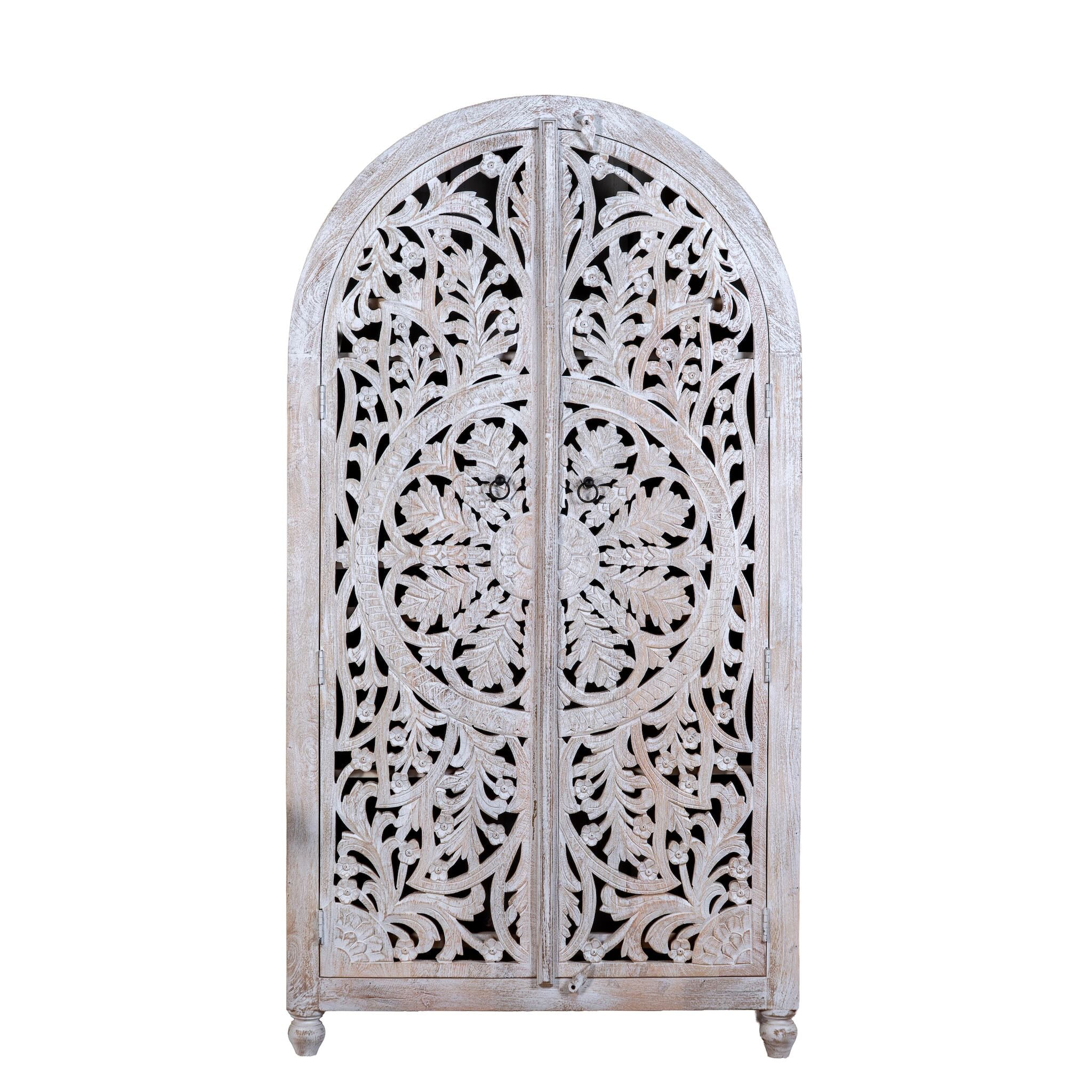 White background image of a Bhuvana arched mango wood wardrobe featuring a sculptural half-round design, intricate hand-carved floral detailing, and carved legs—an artisanal piece in the collection of arched wardrobes and mango wood wardrobes.