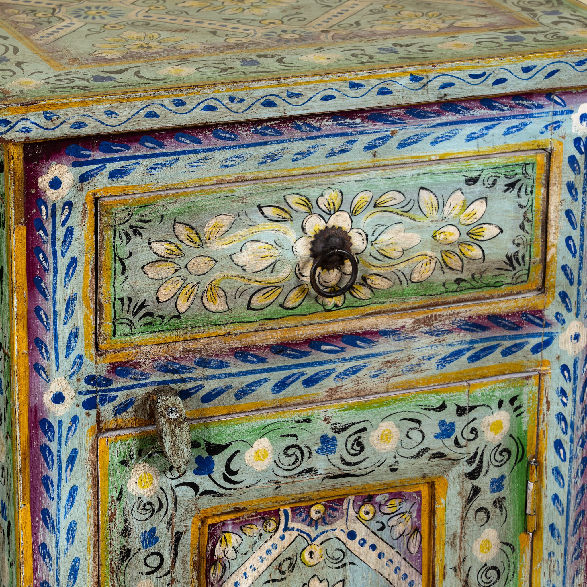Close up image of a pair of hand-painted nightstands made of reclaimed wood in boho style, sustainable furniture with drawer and cabinet, 45 × 35 × 70 cm.