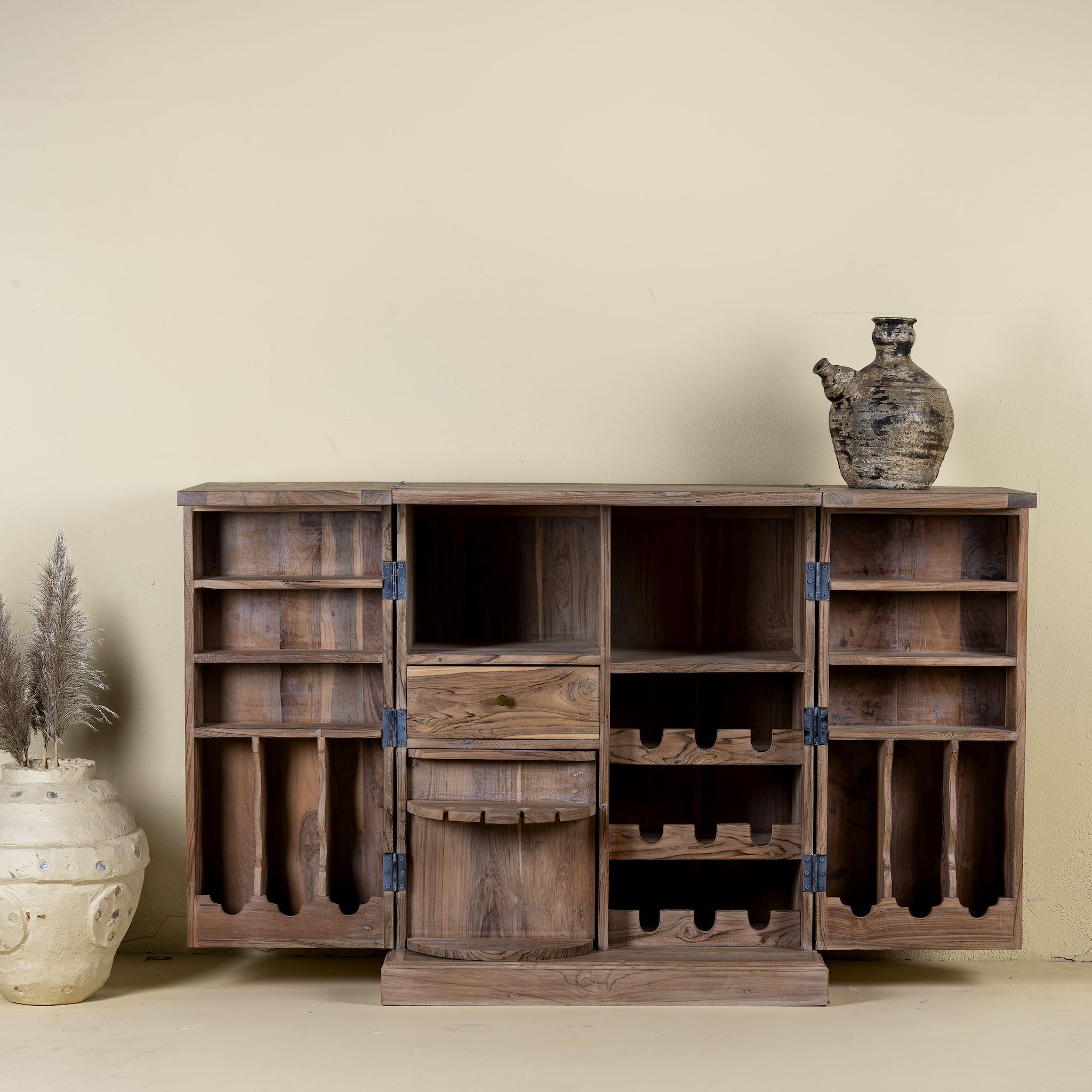 Foldable bar table made of reclaimed teak wood with inside storage.