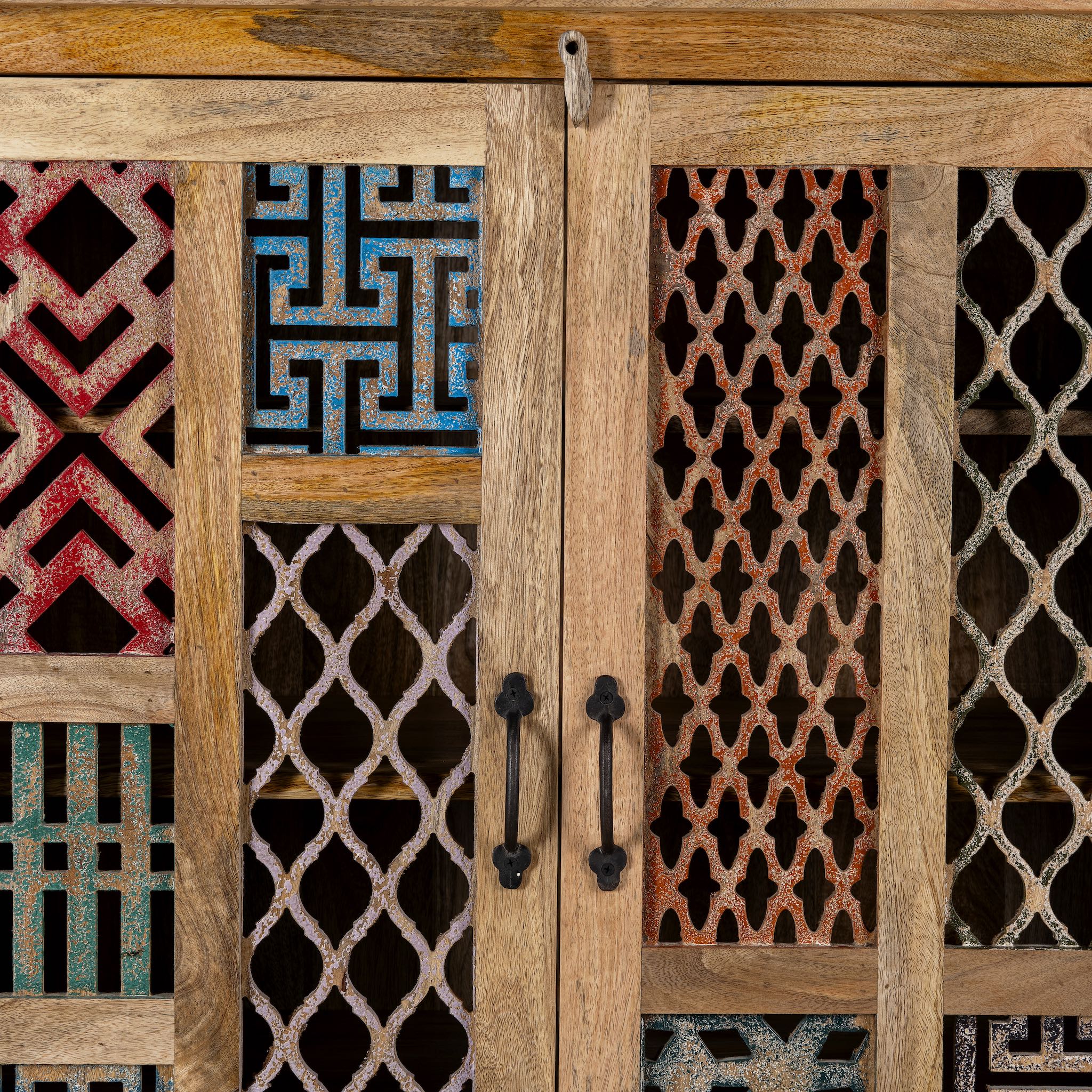 Close up image of a artisanal mango wood cabinet with hand-carved floral and geometric lattice doors, distressed finish; ideal for boho style interiors, 100 × 45 × 130 cm.