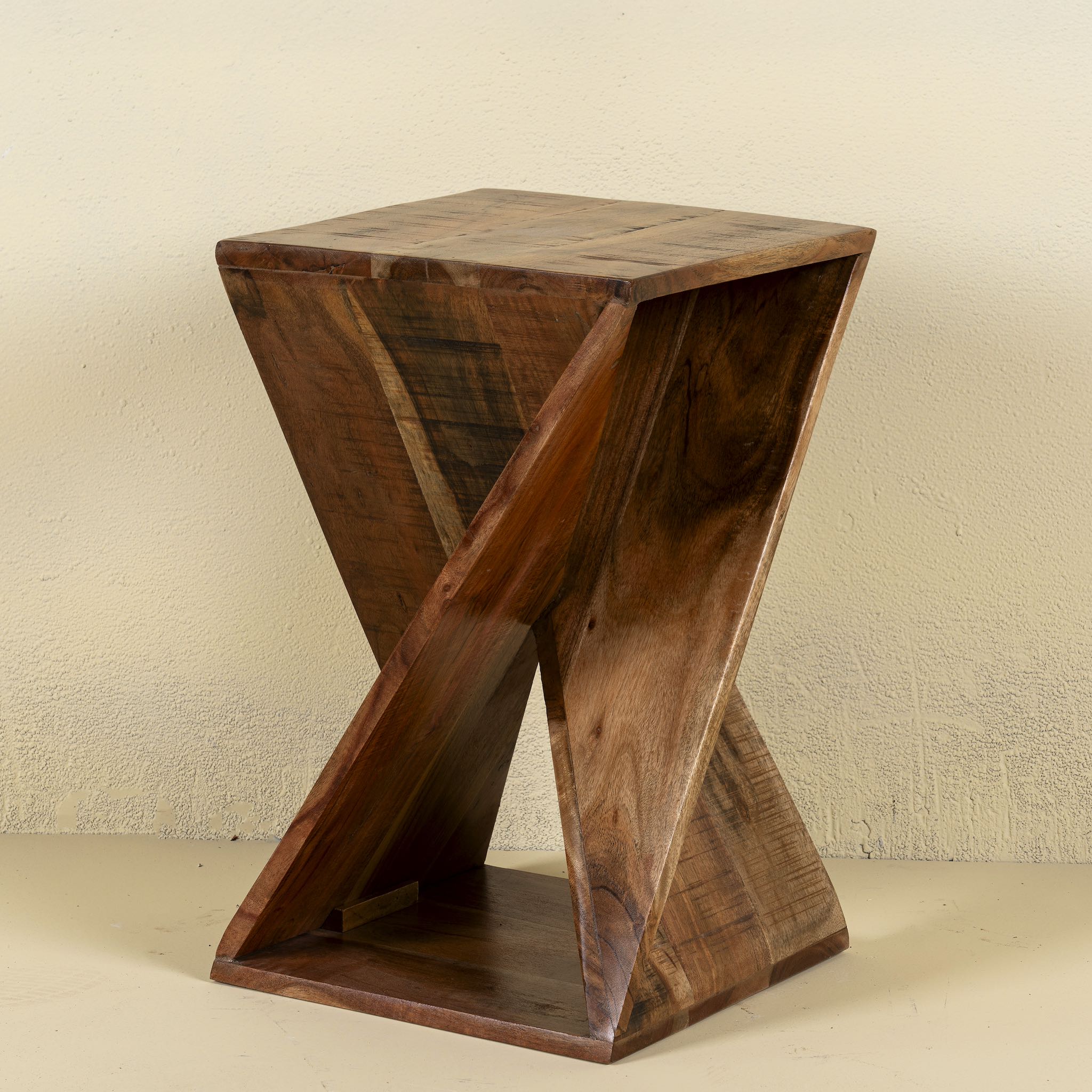 Front view of a twisted Mango wood hand crafted side table.