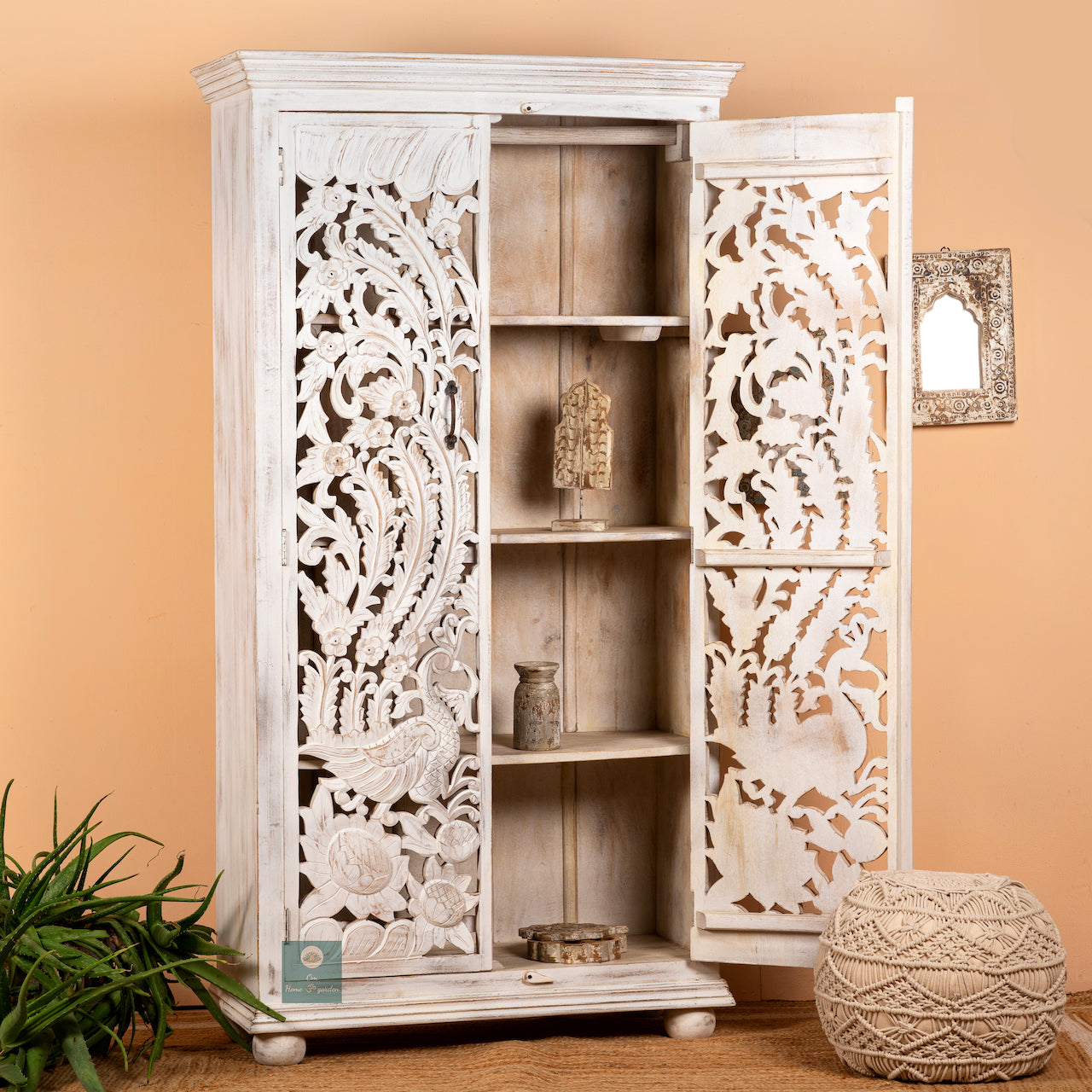 Open door image of a hand-carved mango wood wardrobe with peacock and floral motifs, whitewashed finish; elegant wooden wardrobe and mango wood furniture, 190 × 100 × 40 cm.