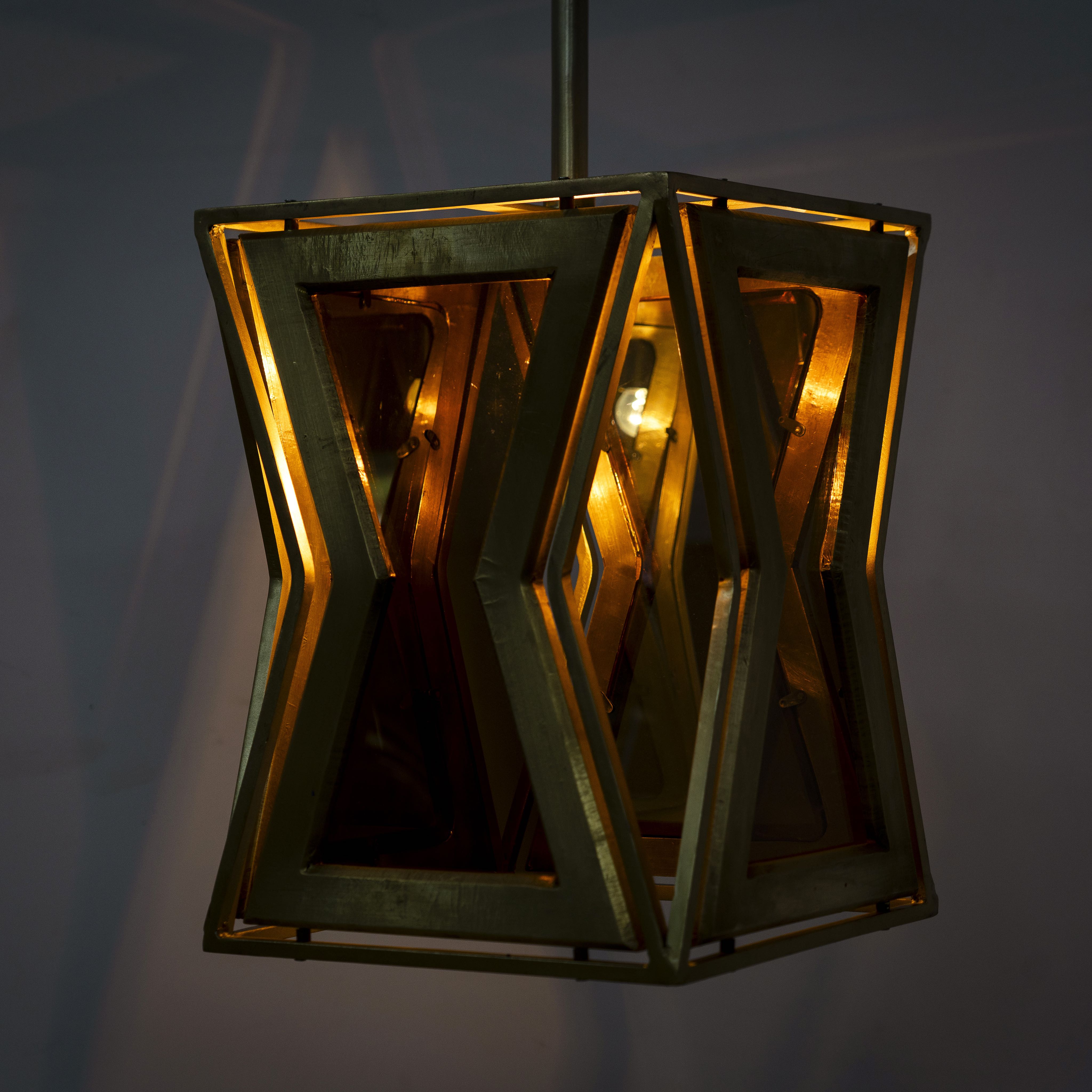 Lighted version of a tapered pendant lamp with wood, brass cladding, and tinted glass panels – vintage lighting meets modern design, ideal for use as an iron pendant lamp in living rooms, dining areas, or entryways.