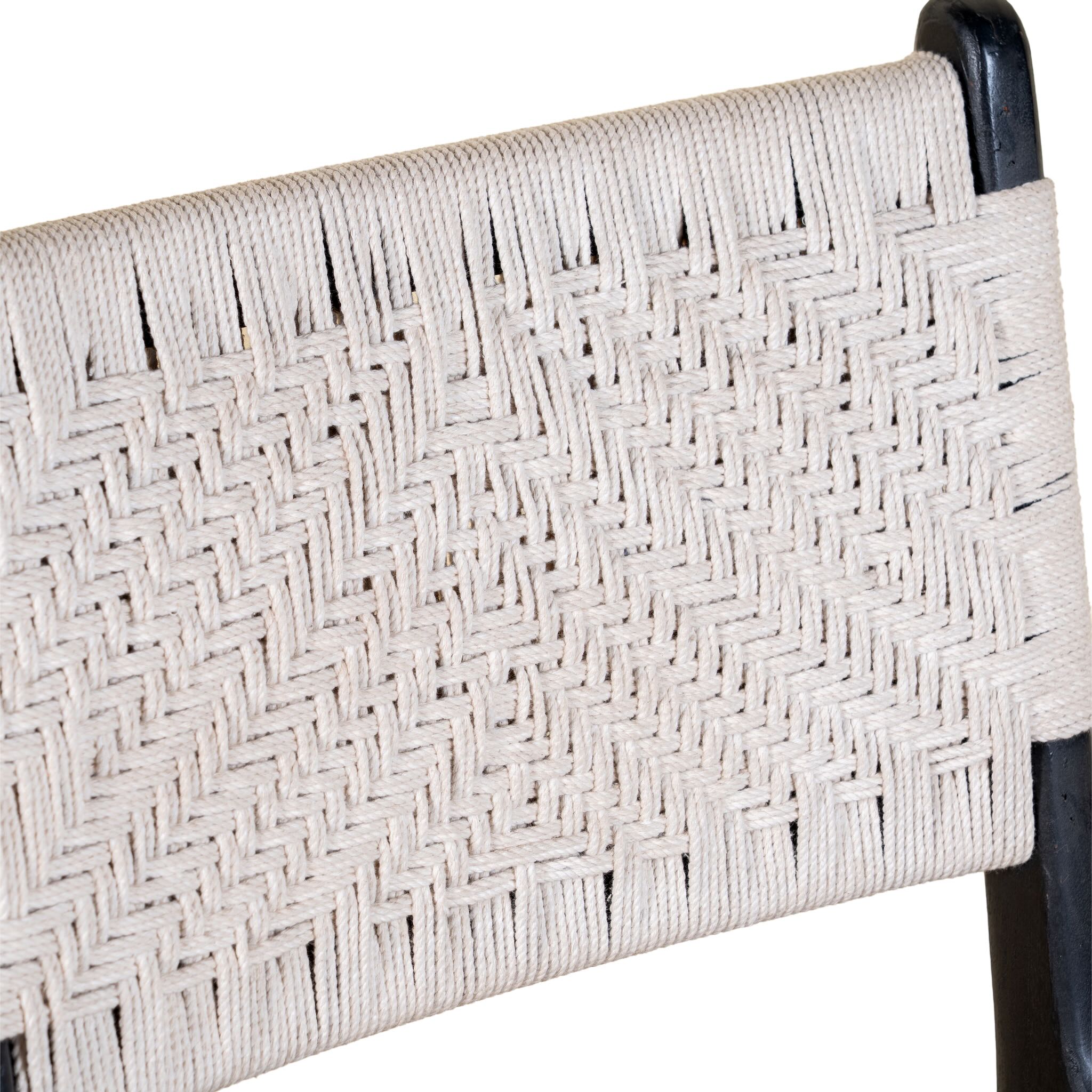 Close up image of a Dhanya black Acacia wood chair with hand-woven cotton rope seat and backrest—an elegant piece of wooden seating and part of our artisan akacia wood chairs collection.