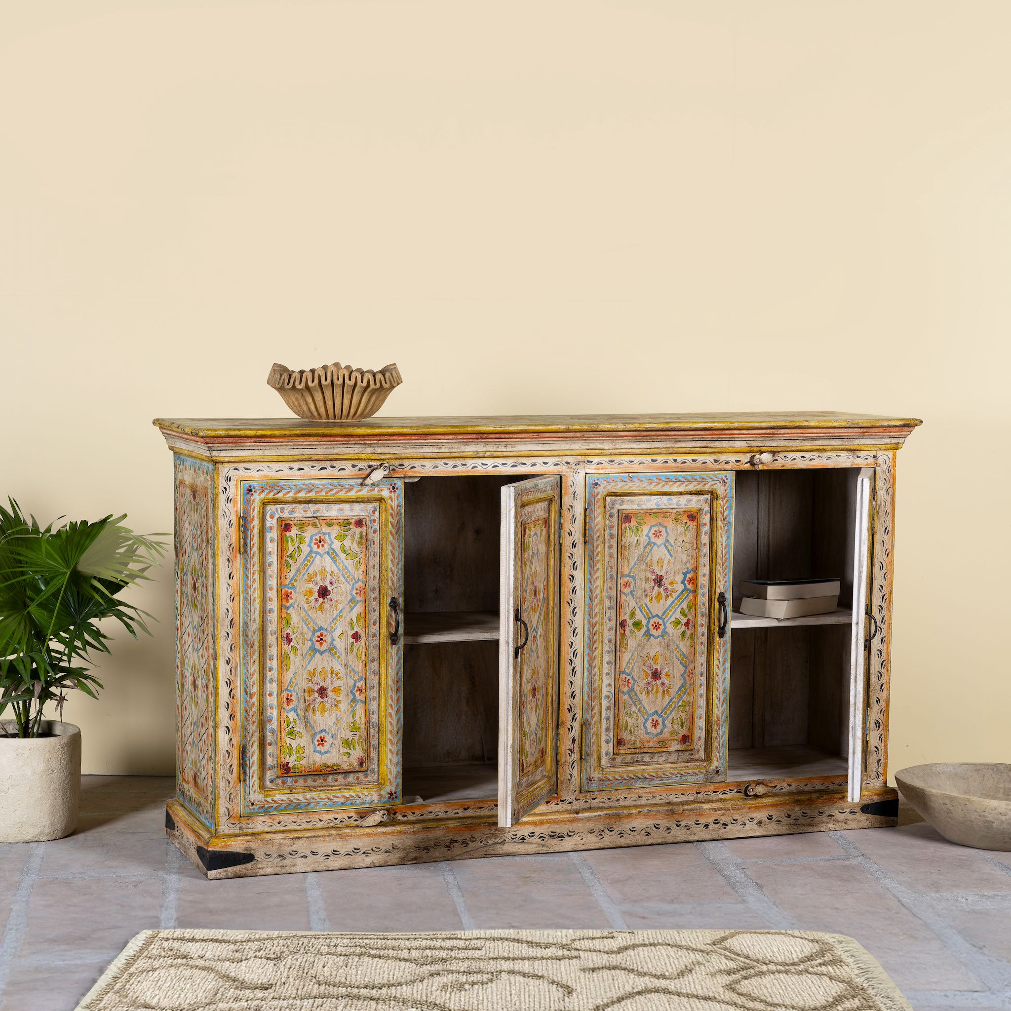Open door image of a hand painted wooden dresser with floral and geometric motifs, reclaimed wood living room furniture in vintage boho style, 170 × 45 × 95 cm.