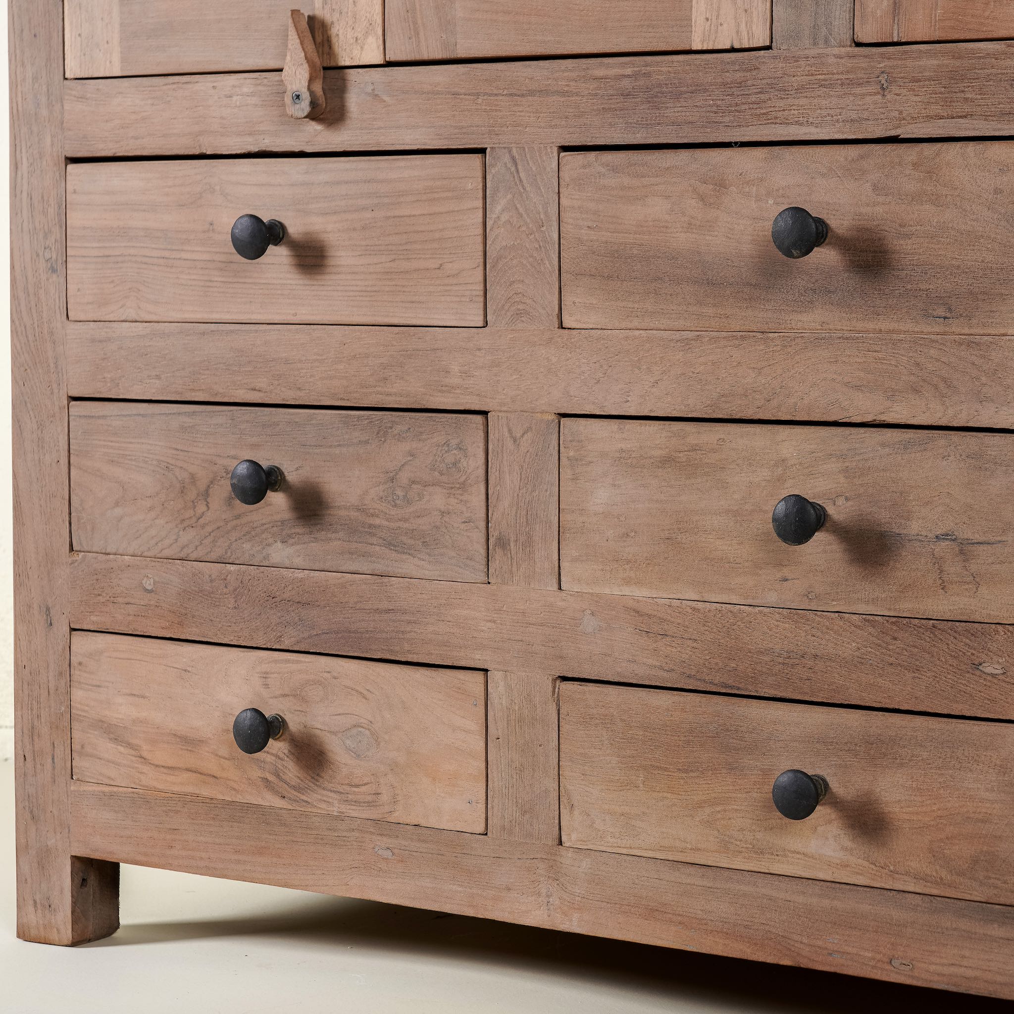 Close up image of a sustainable furniture teak sideboard made from reclaimed old teak wood in Ibiza style, 120 × 40 × 100 cm.