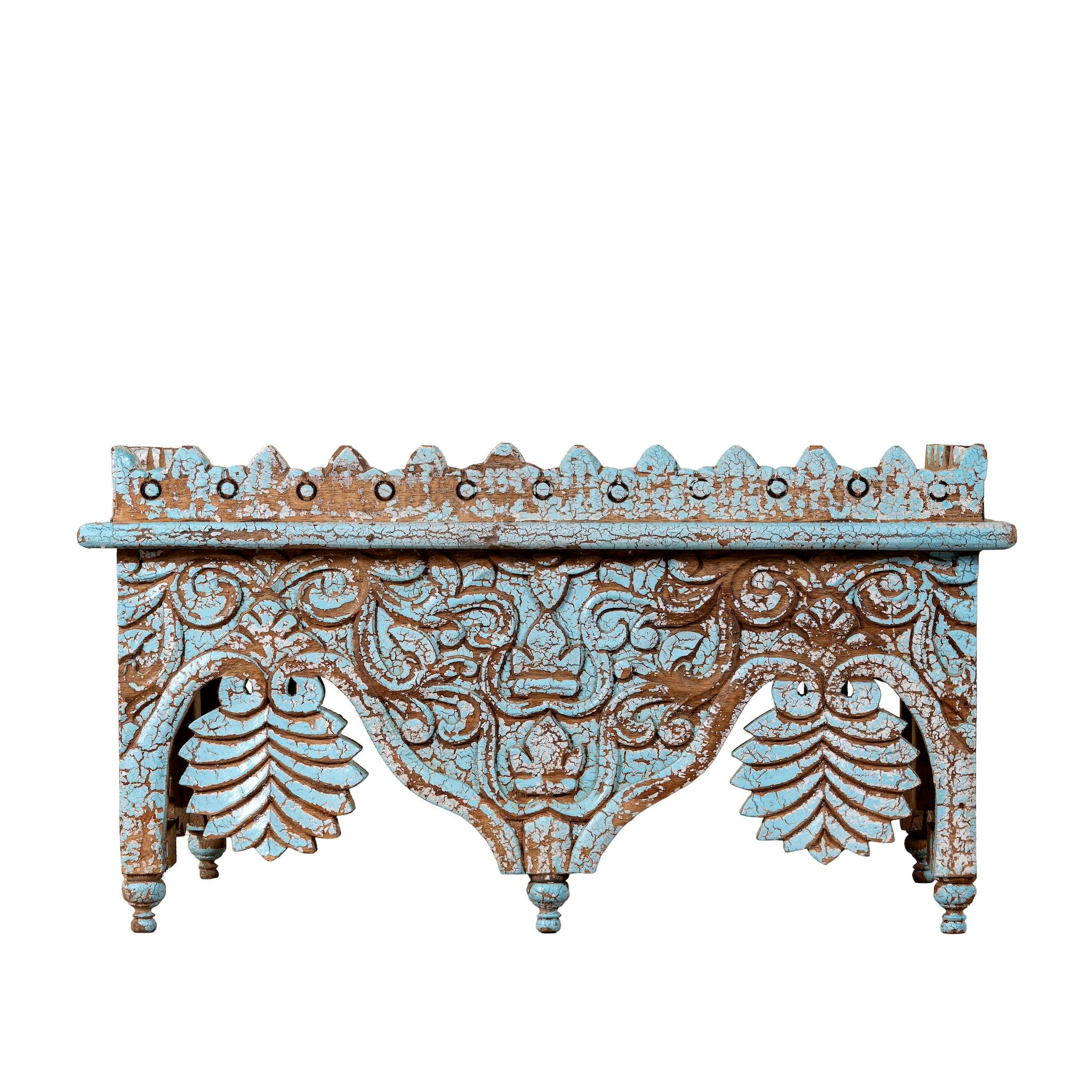 White background image of a turquoise distressed mango wood shelf with ornate carvings; artisanal furniture and vintage home decor, 60 × 32 × 32 cm.