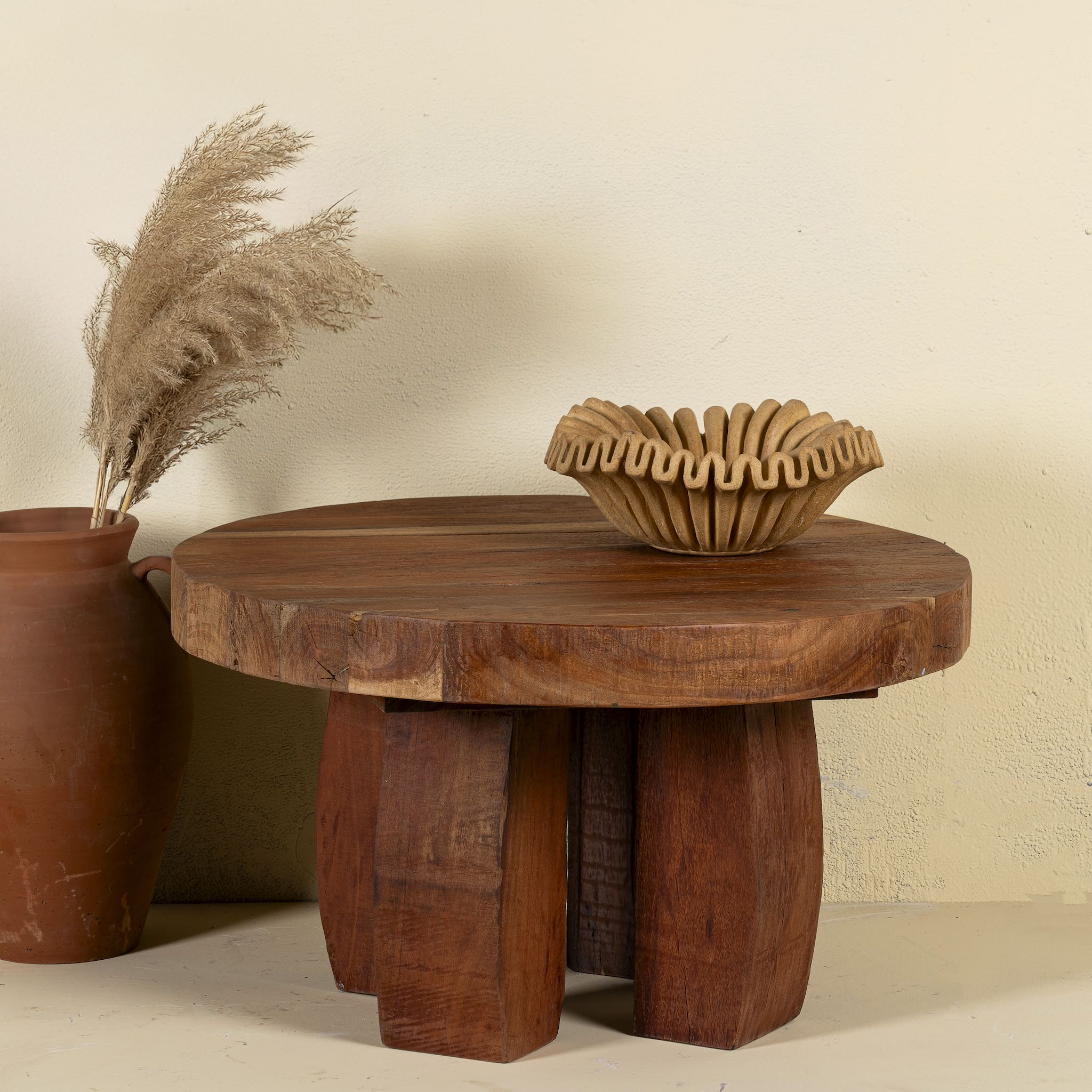 Rustic wood coffee table with round reclaimed teak top and black charred finish; sustainable furniture, 70 cm diameter, 40 cm height.