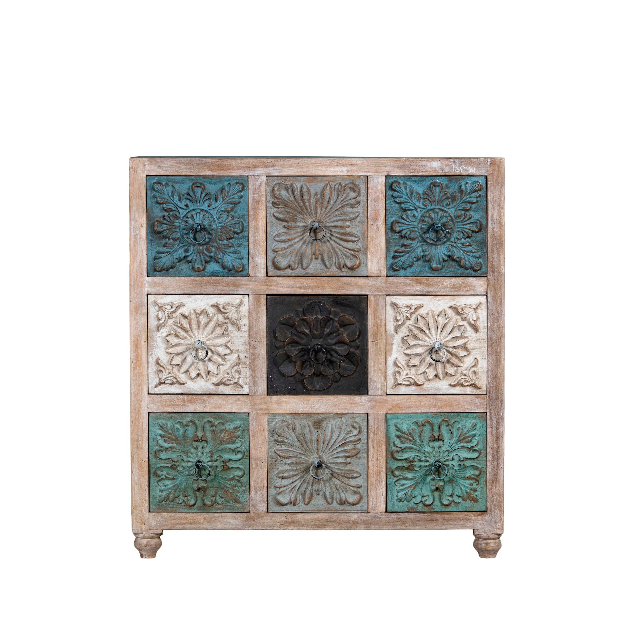 Decorative wooden cabinet with embossed floral patterns on a white background