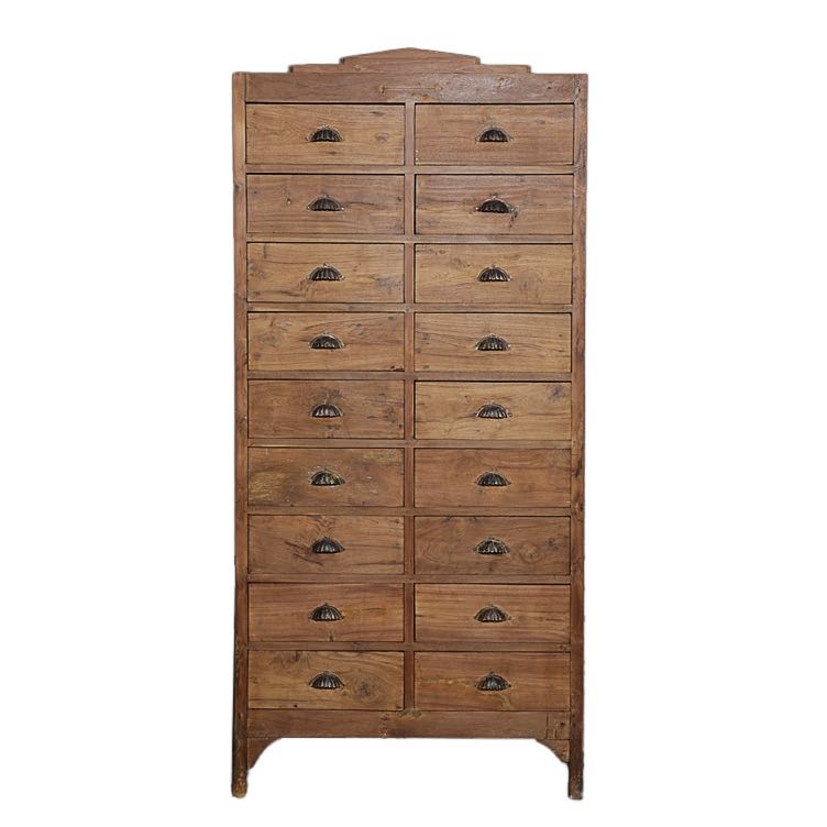 White background image of a tall teak wood furniture chest of drawers with 18 drawers and iron handles, in natural teak finish, 88 × 190 × 40 cm