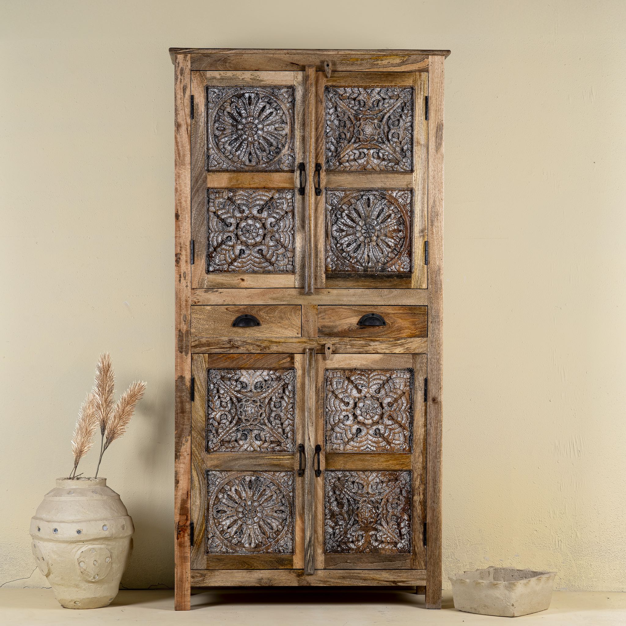 Hand-carved mango wood cabinet with floral motifs and silver finish – bedroom furniture with rustic charm and artisanal detail.