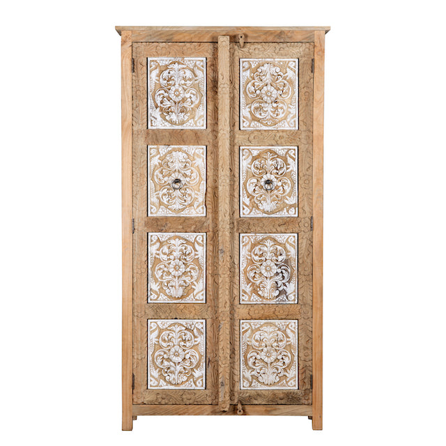 White background image of a and carved wooden wardrobe made of solid mango wood with whitewashed floral details; Ibiza-style mango wood wardrobe, 190 × 100 × 40 cm.