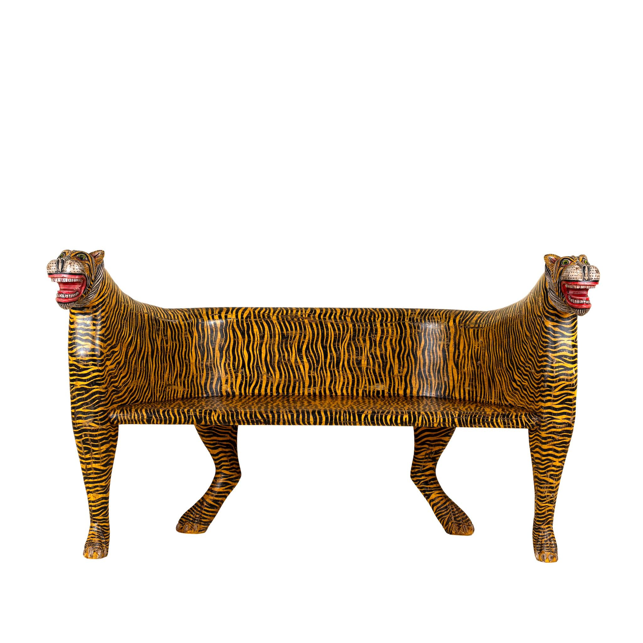 White background image of a hand-painted Tiger bench with double tiger heads and hand-painted stripes; unique furniture made from reclaimed teak, 160 × 70 × 90 cm.
