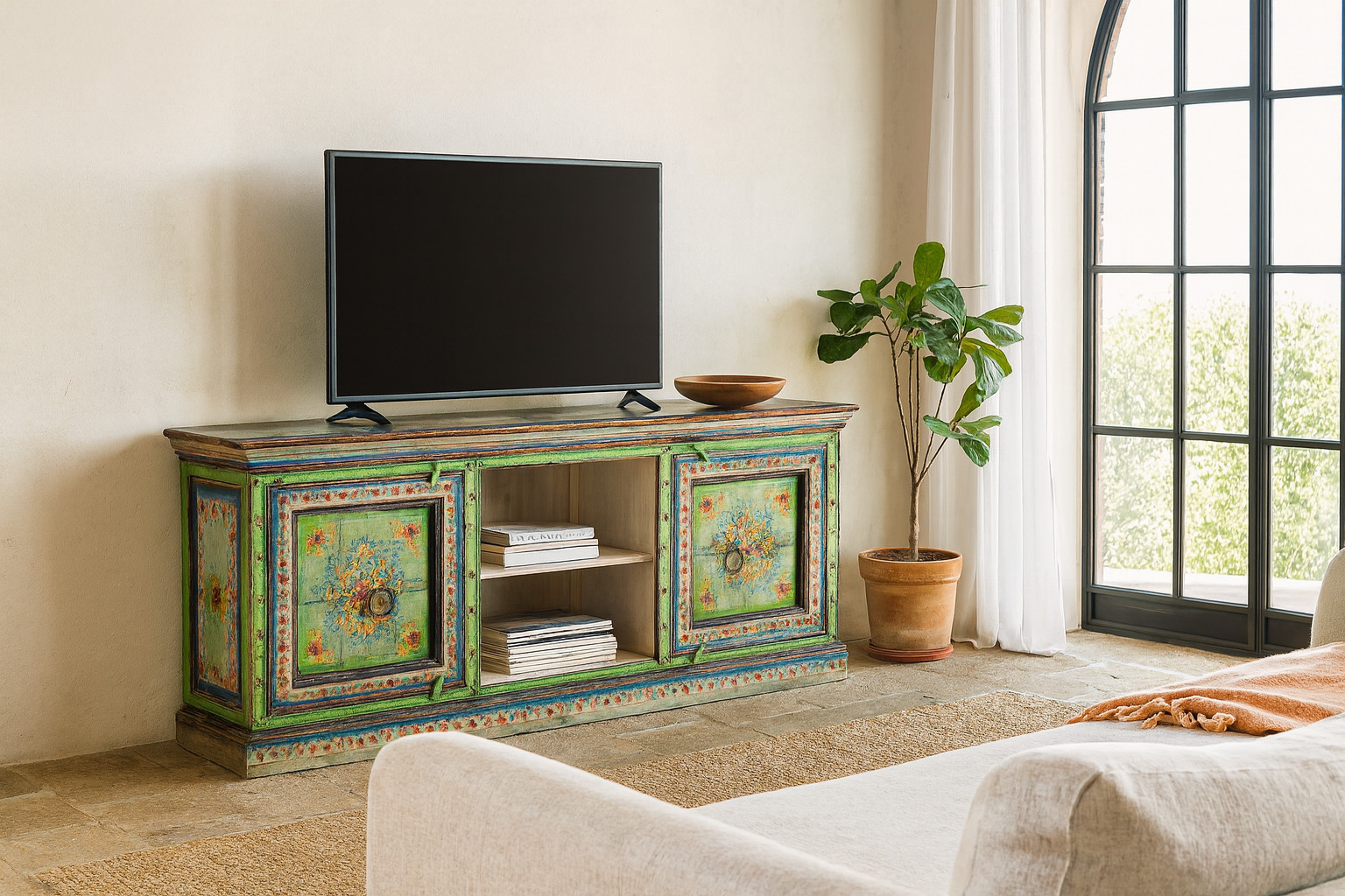 Lifestyle scene of a hand-painted reclaimed wood vintage lowboard with floral motifs – a colourful piece of sustainable furniture for artistic and rustic interiors.