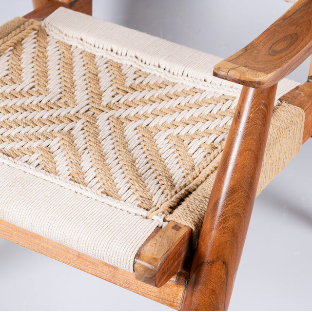Close up image of an acacia wood chair with handwoven cotton rope seat and backrest, artisanal wooden armchair, 61 × 47 × 83 cm.