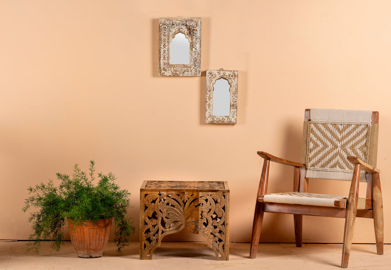 Lifestyle image of an acacia wood chair with handwoven cotton rope seat and backrest, artisanal wooden armchair, 61 × 47 × 83 cm.