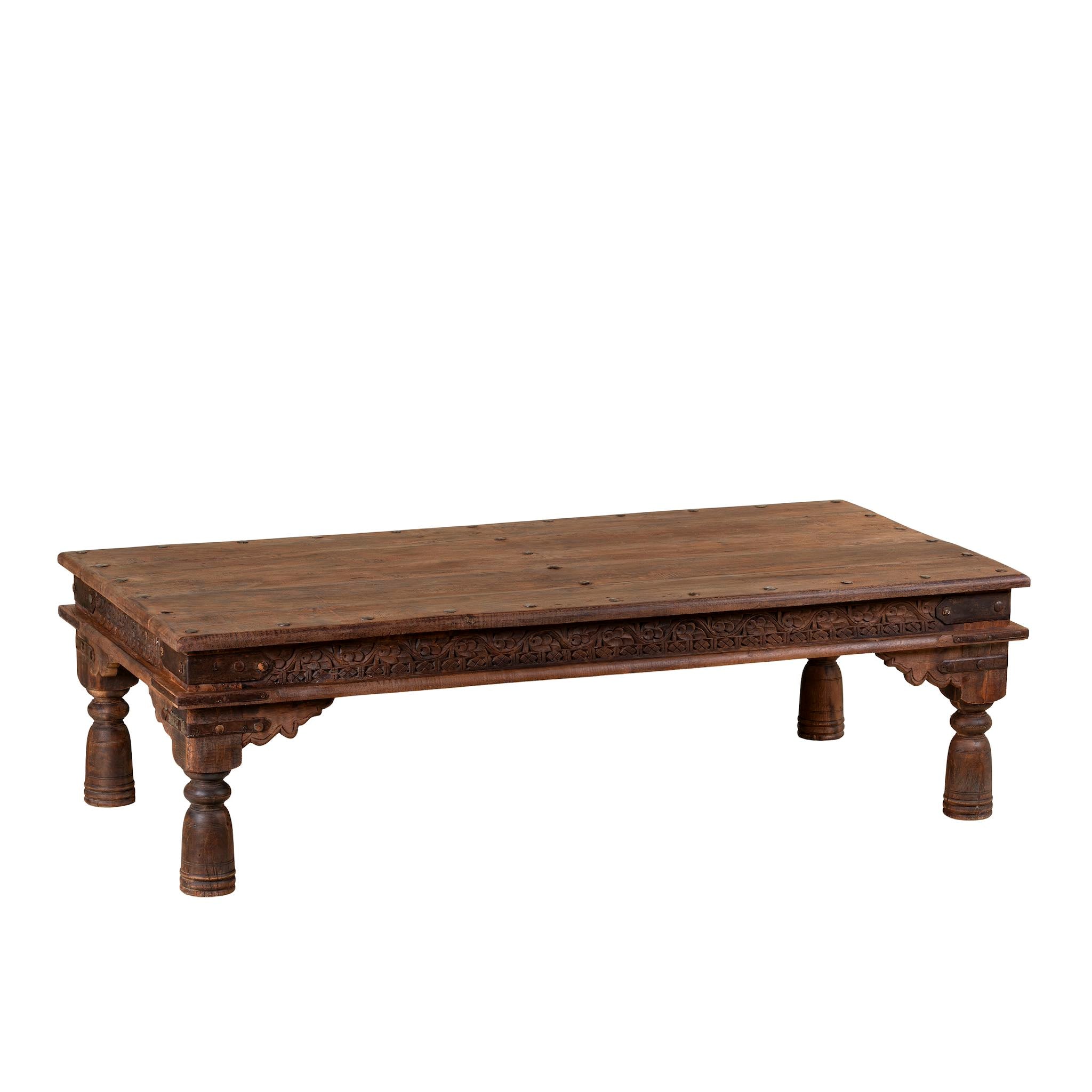 White background image of a rectangular teak wood coffee table with hand-carved Indian detailing, reclaimed wood finish, and iron accents; 158 × 76 × 46 cm.