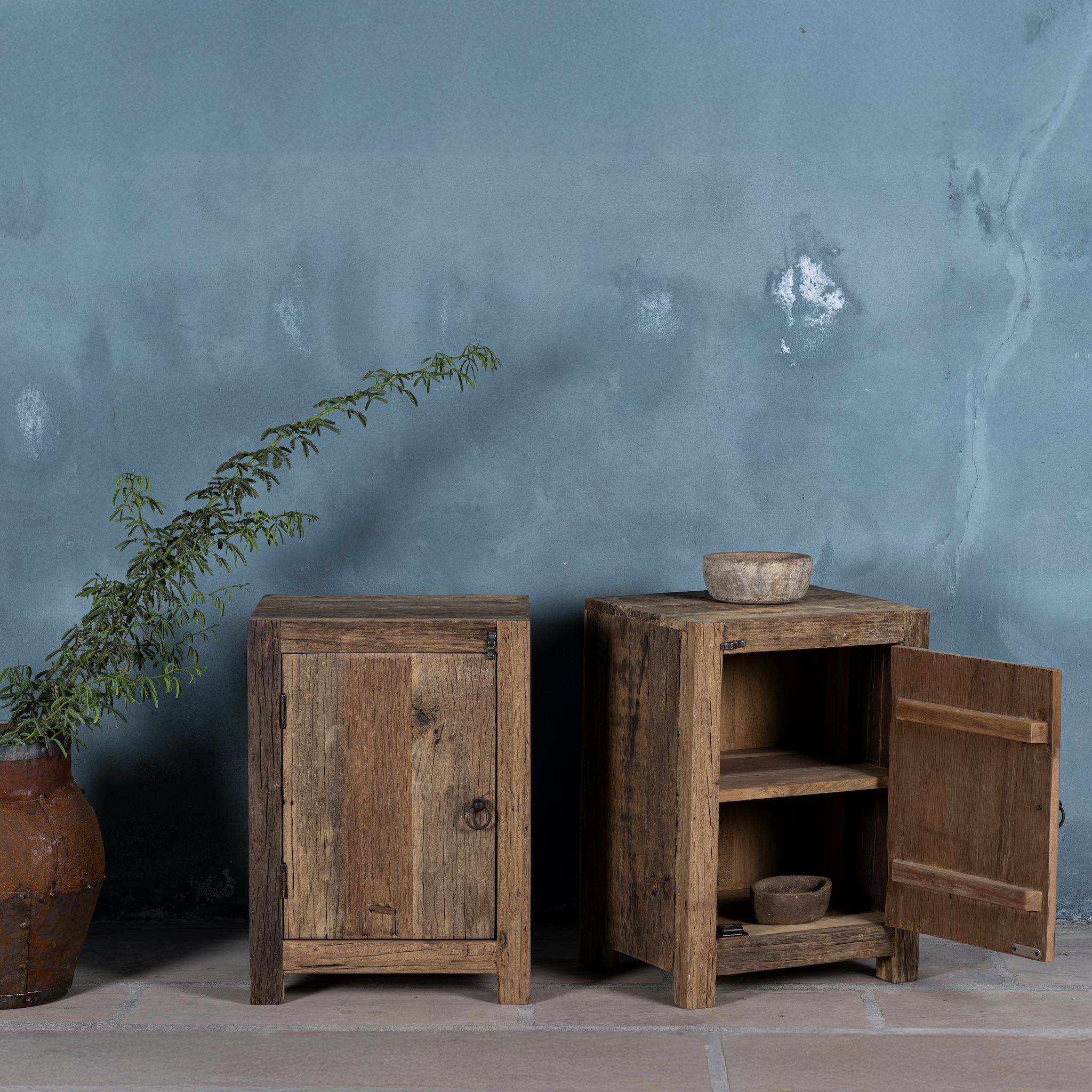 Open door image of a reclaimed wood bedside table with single cabinet door – handcrafted driftwood furniture ideal for rustic minimalism and natural interior styling.