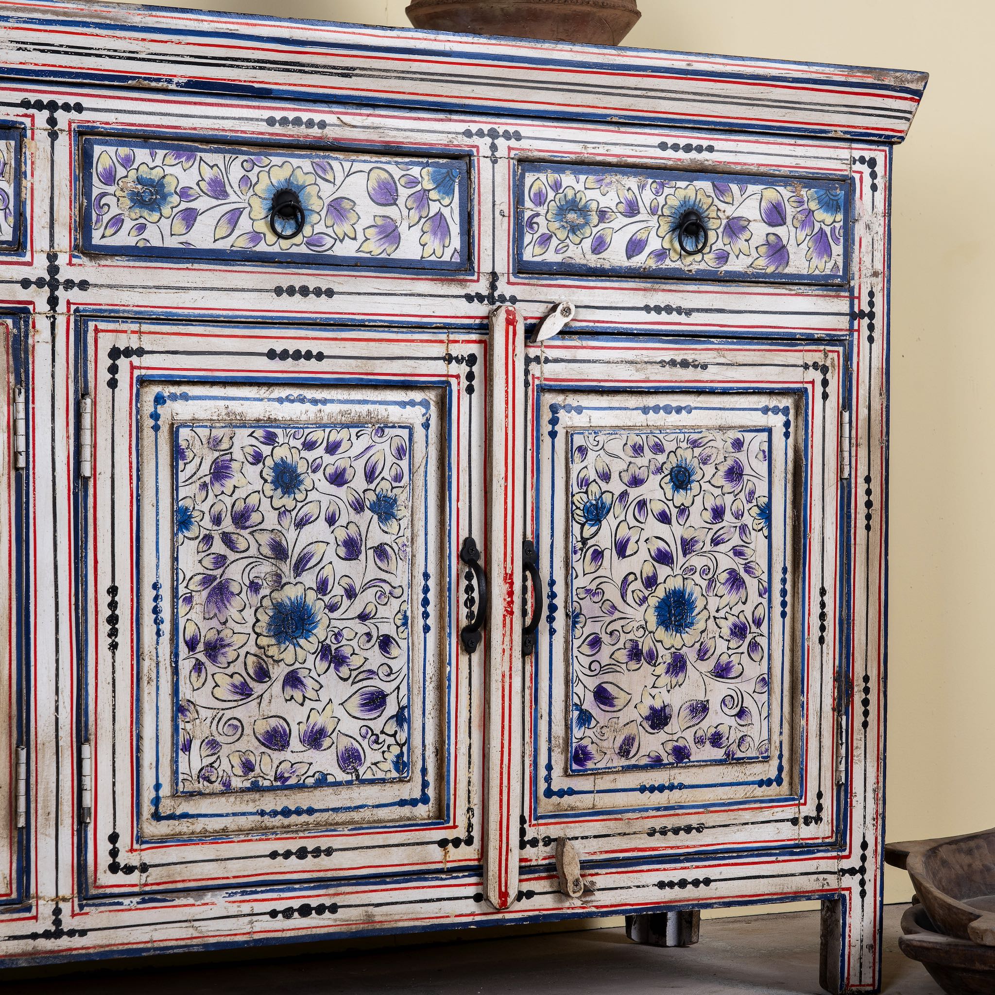 Close up image of a hand painted wooden furniture sideboard with floral motifs, unique furniture piece made from reclaimed wood, 180 × 40 × 90 cm.