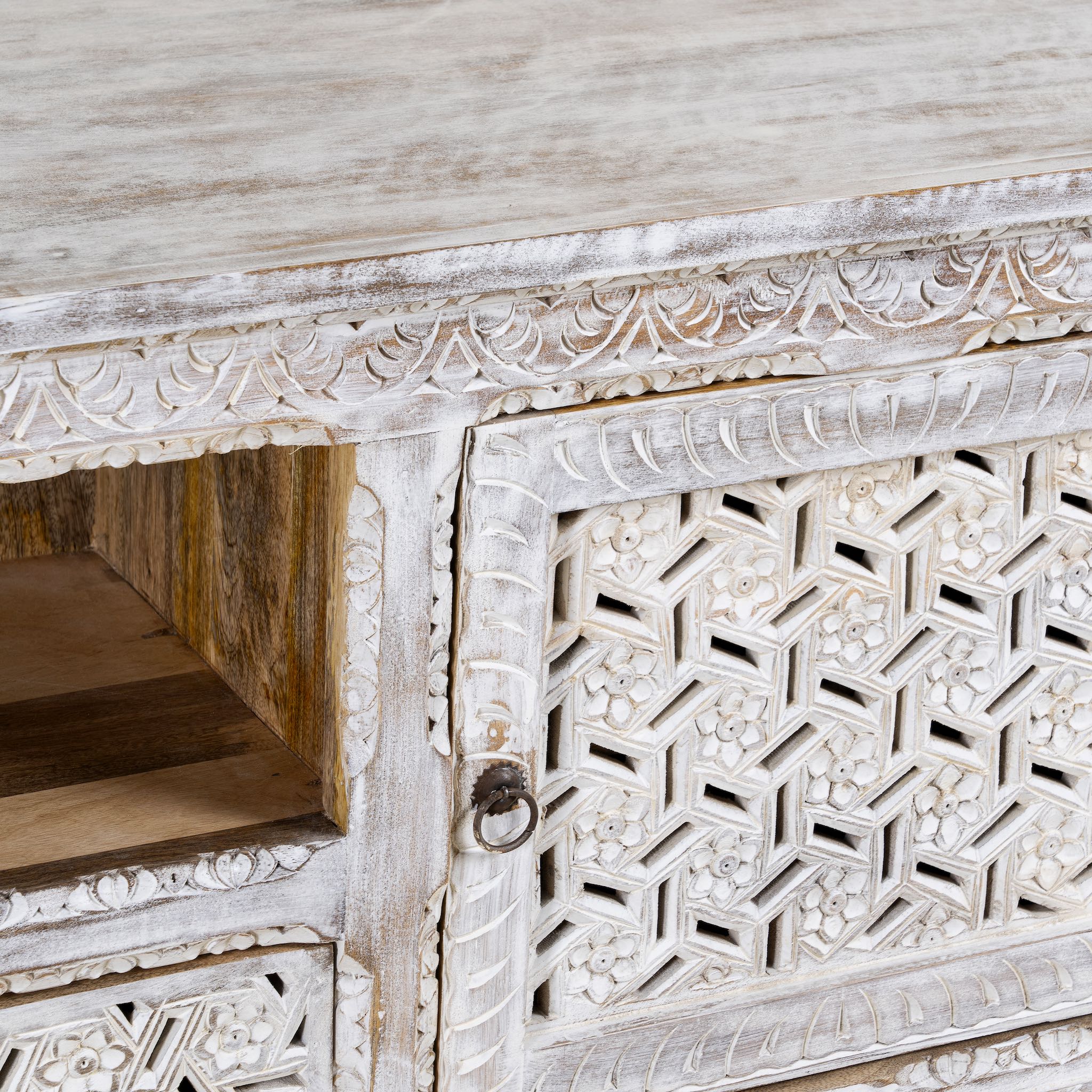 Close up image of a hand-carved mango wood TV unit Pari in Mediterranean style, versatile living room furniture with drawers and compartments, 170 × 60 × 37 cm.
