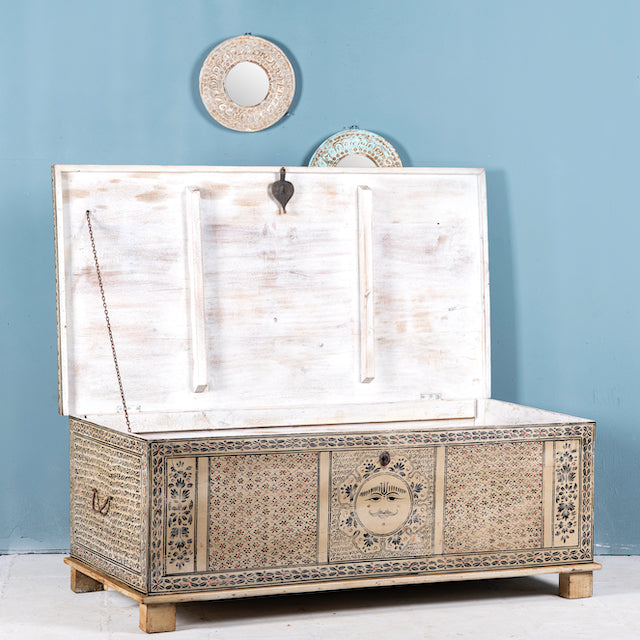 Side angle image with open lid of a hand-painted reclaimed wood chest box with Indian motifs – vintage home decor and versatile storage with coffee table function.