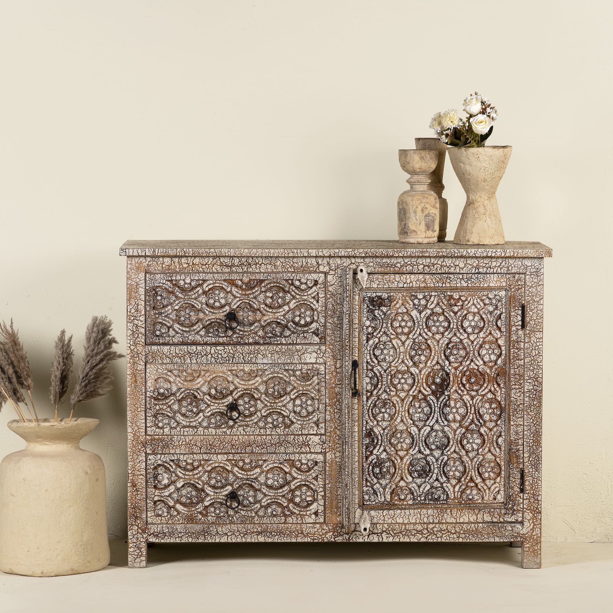 Hand-carved sideboard in mango wood furniture style with two doors, three drawers, and vintage three-layer finish.