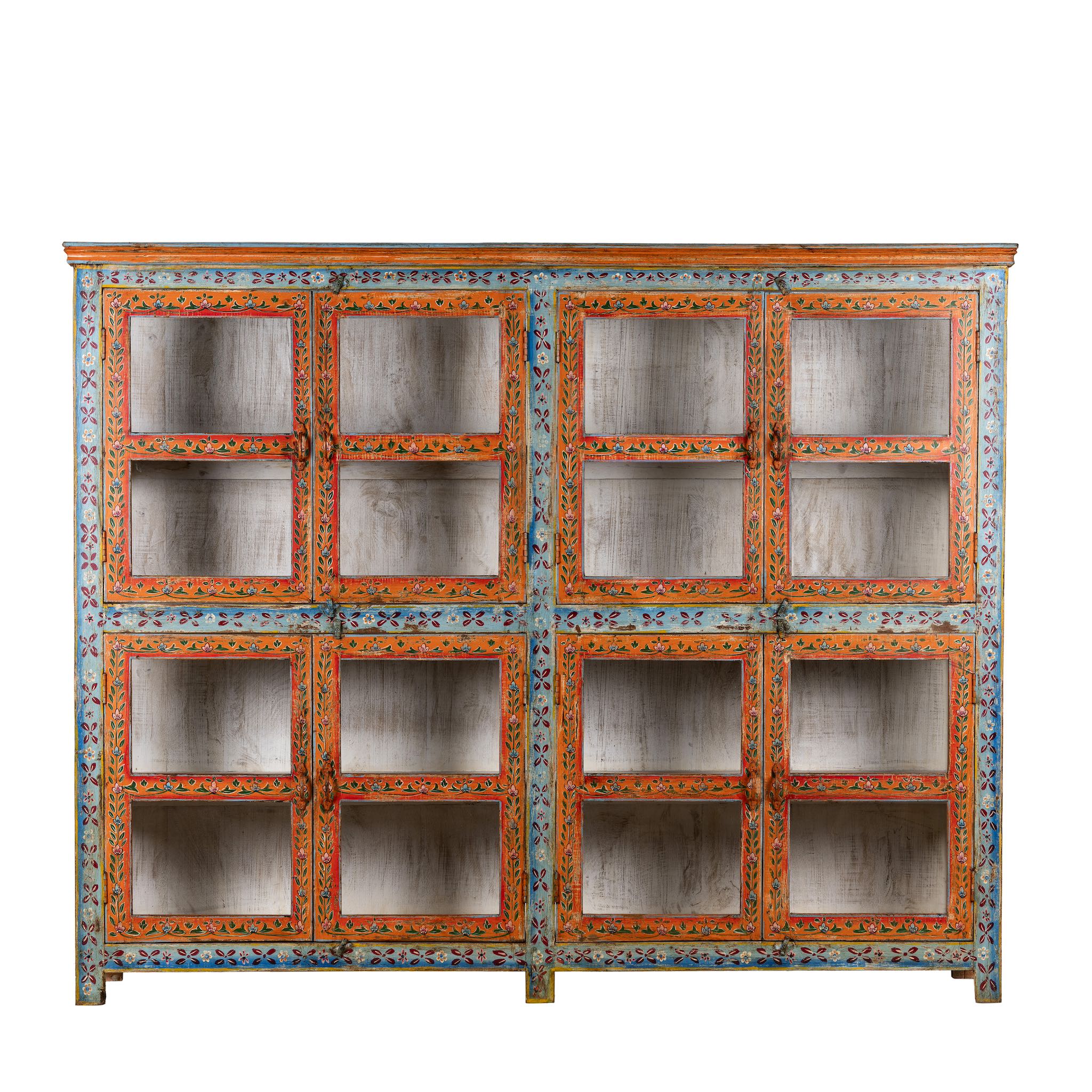 White background image of a hand-painted reclaimed wood showcase cabinet with Ibiza-style motifs, glass-panelled doors, unique wooden furniture for living room, 213 × 40 × 170 cm.