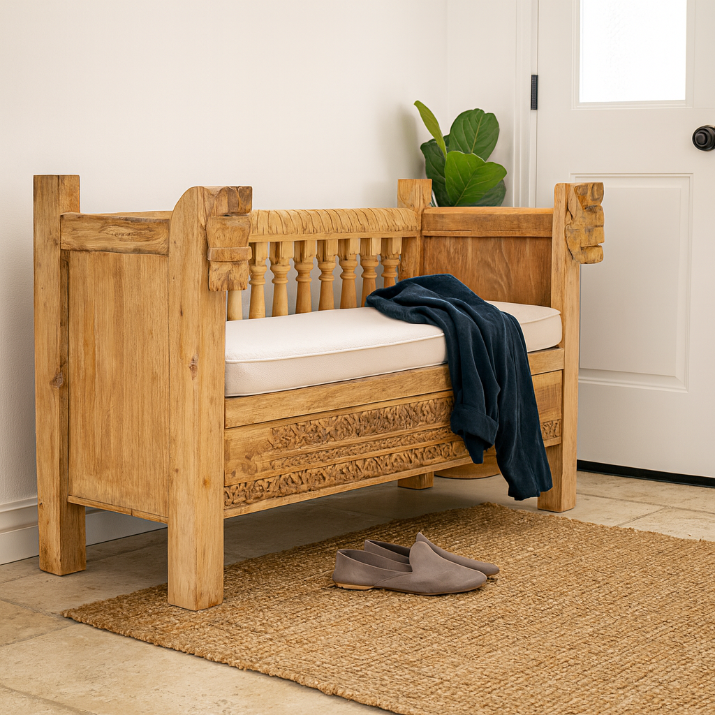 Lifestyle imagination of a reclaimed teak wood bench with horse-head carvings and hidden storage; sustainable double-seater with cushion, 150 × 93 × 77 cm.