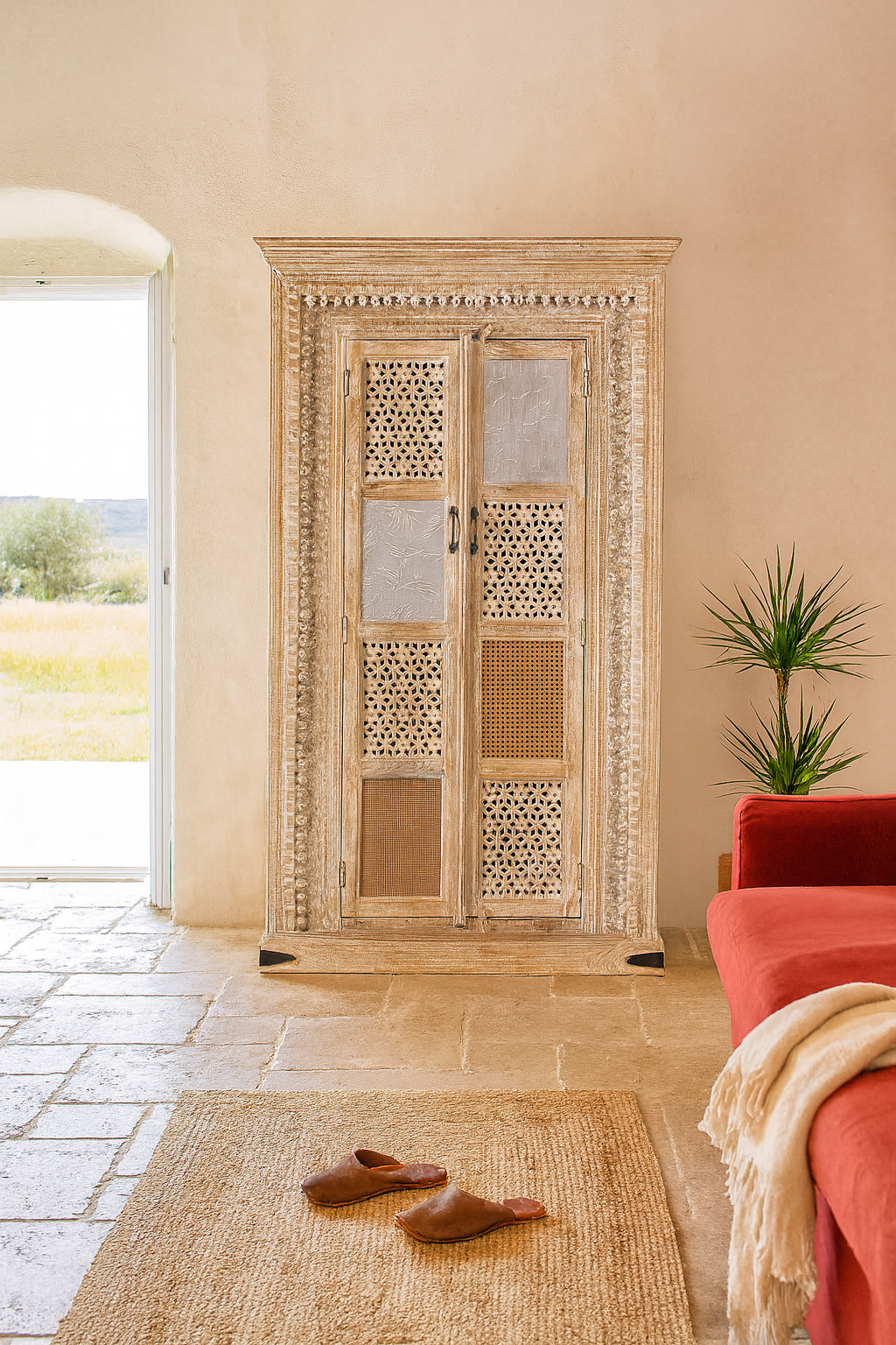 Whitewashed mango wood cabinet with hand-carved details, rattan inserts, and glass panels; versatile as bedroom furniture or wooden wardrobe; 192 × 110 × 40 cm.