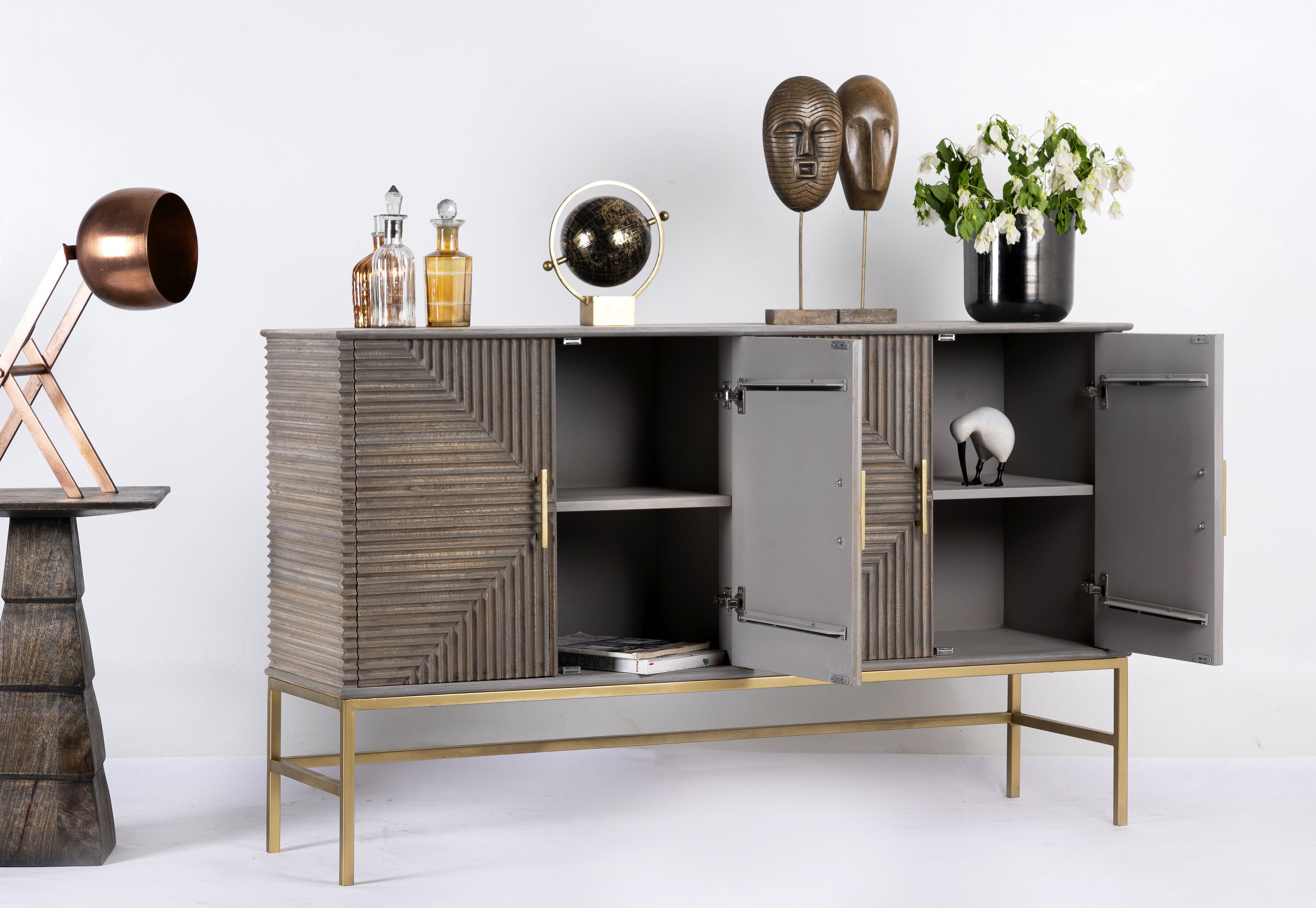 Interior storage compartments of Sahishnu mango wood sideboard with elegant carved fronts