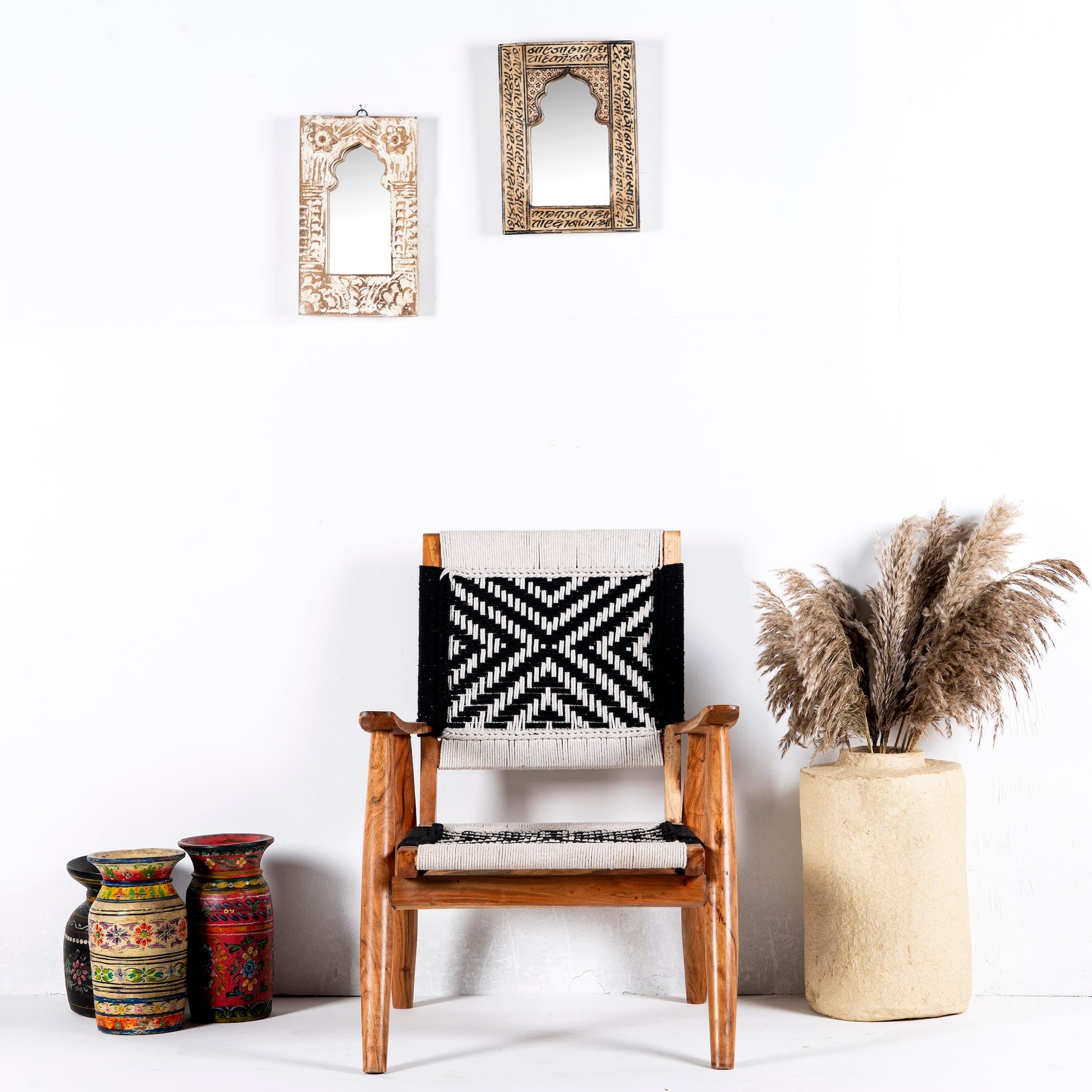 Acacia wood chair with black-and-white handwoven cotton rope seat and backrest; artisanal wooden armchair, 61 × 47 × 83 cm.