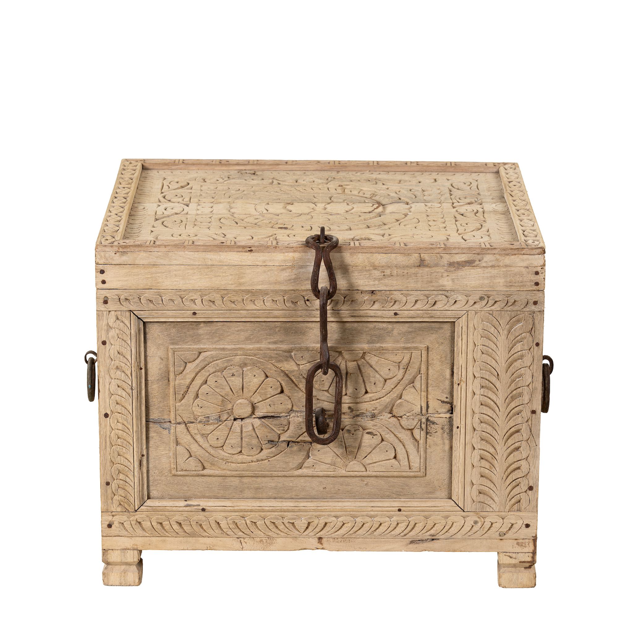 White background image of a hand-carved teak wood chest with iron details – perfect for Ibiza style interior and sustainable storage with artisanal flair.