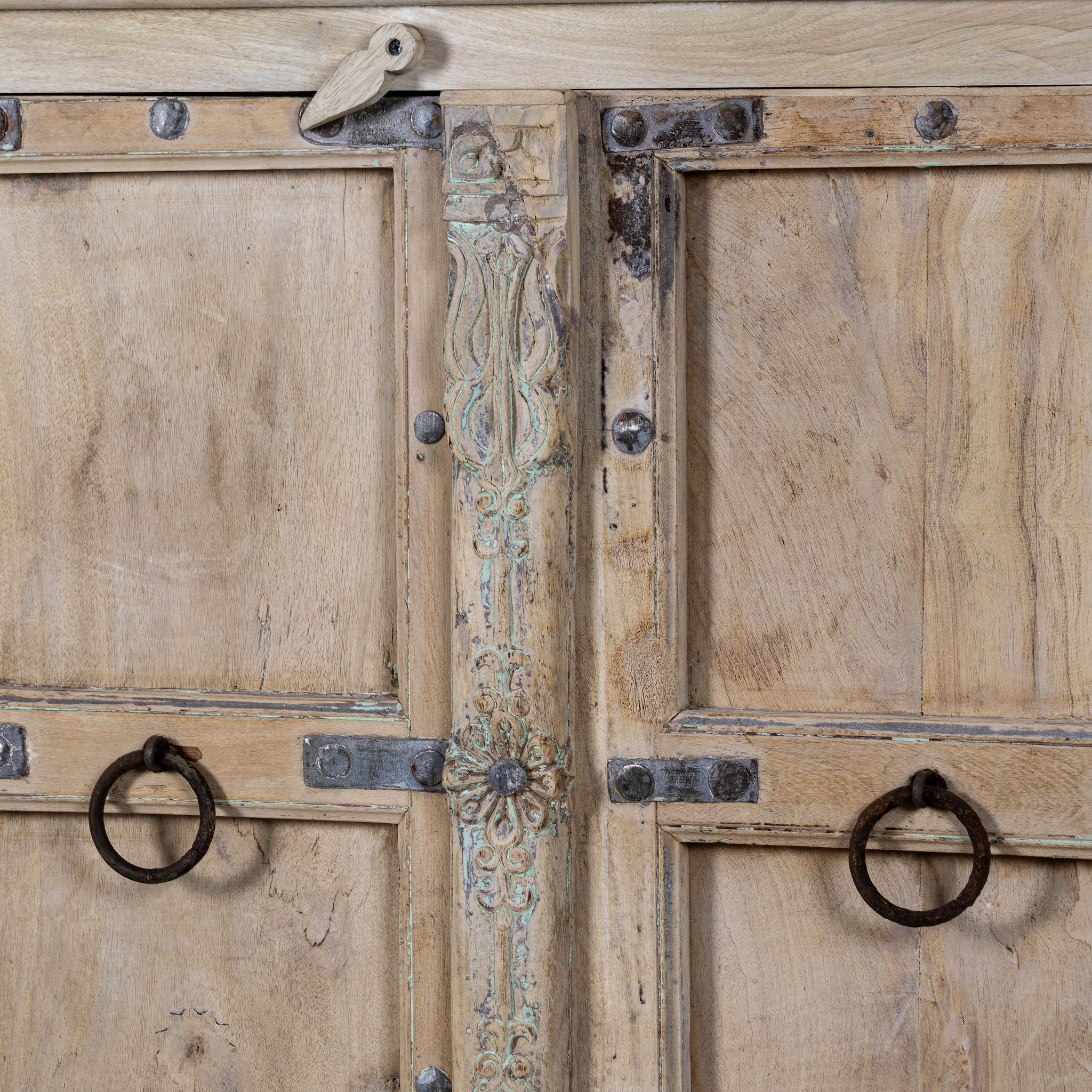 Close up of a unique old Door cupboard finely hand carved in bleached teak wood, driftwood design with iron fittings.