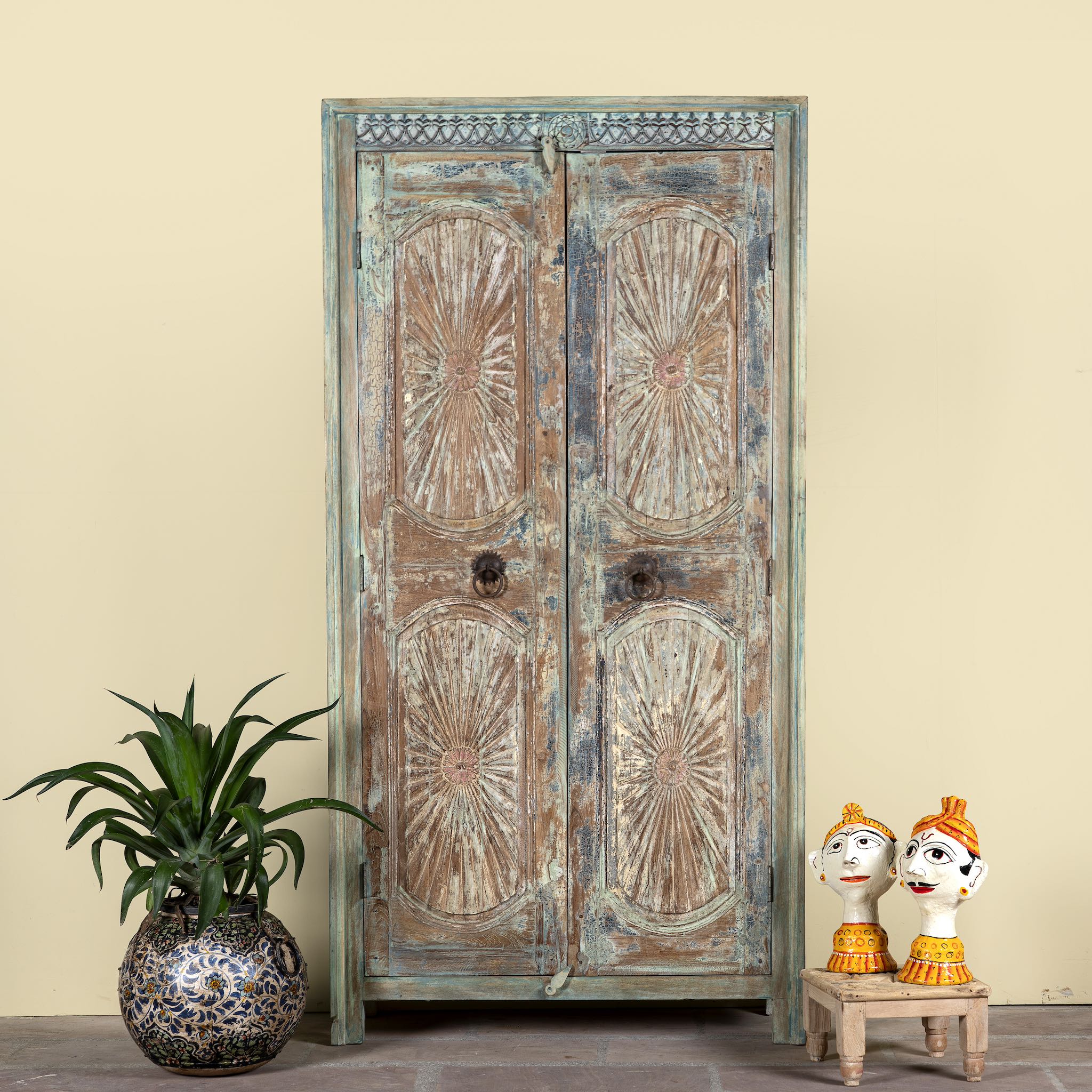Hand-carved reclaimed wood wardrobe with vintage sunburst design – a sustainable furniture piece perfect for Indian home decor and rustic interiors.