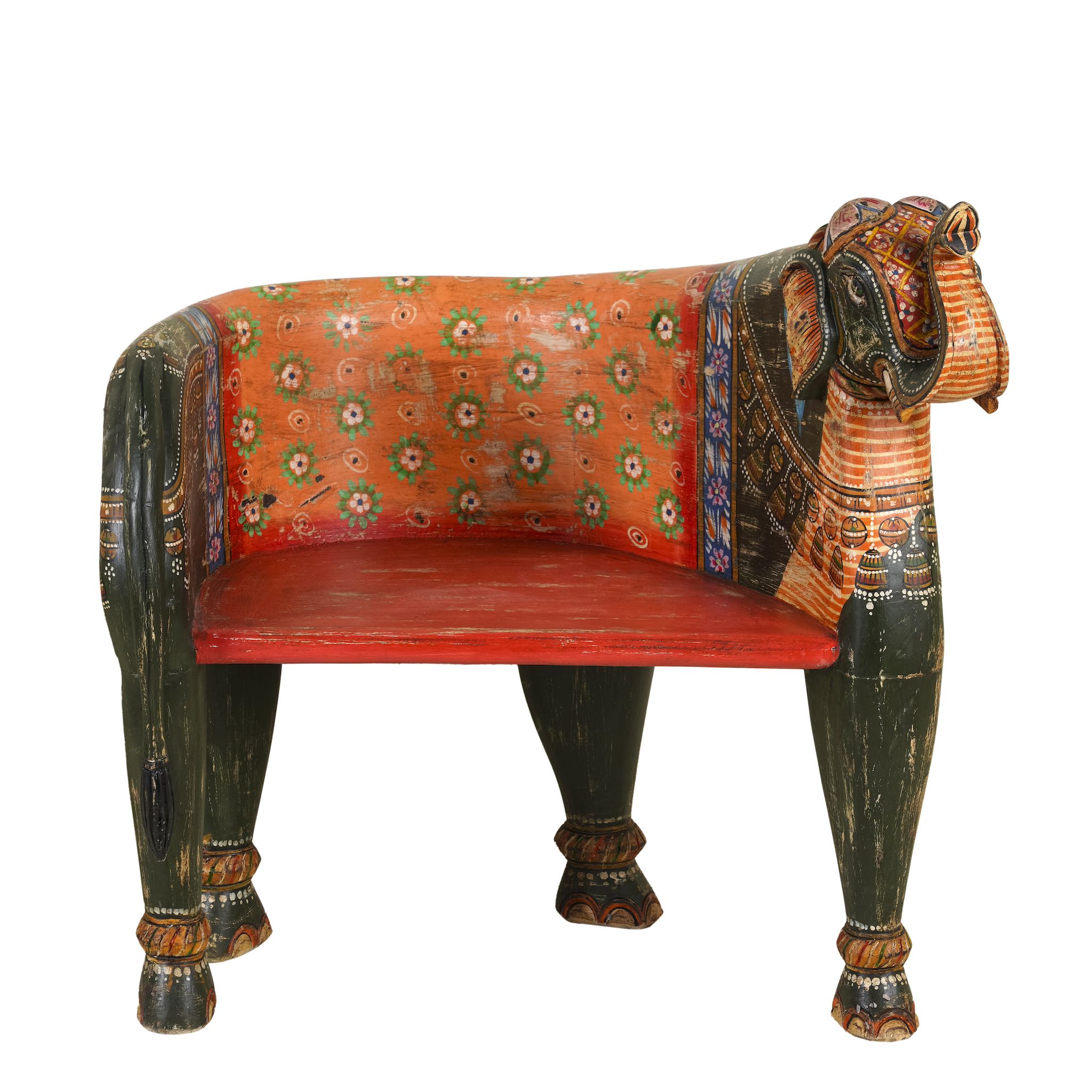 White background image of a elephant-shaped armchair crafted from reclaimed wood, featuring intricate hand-painted details in vibrant red, orange, green, and multi coloured floral patterns, with sculpted elephant head and legs for a whimsical, artistic touch.