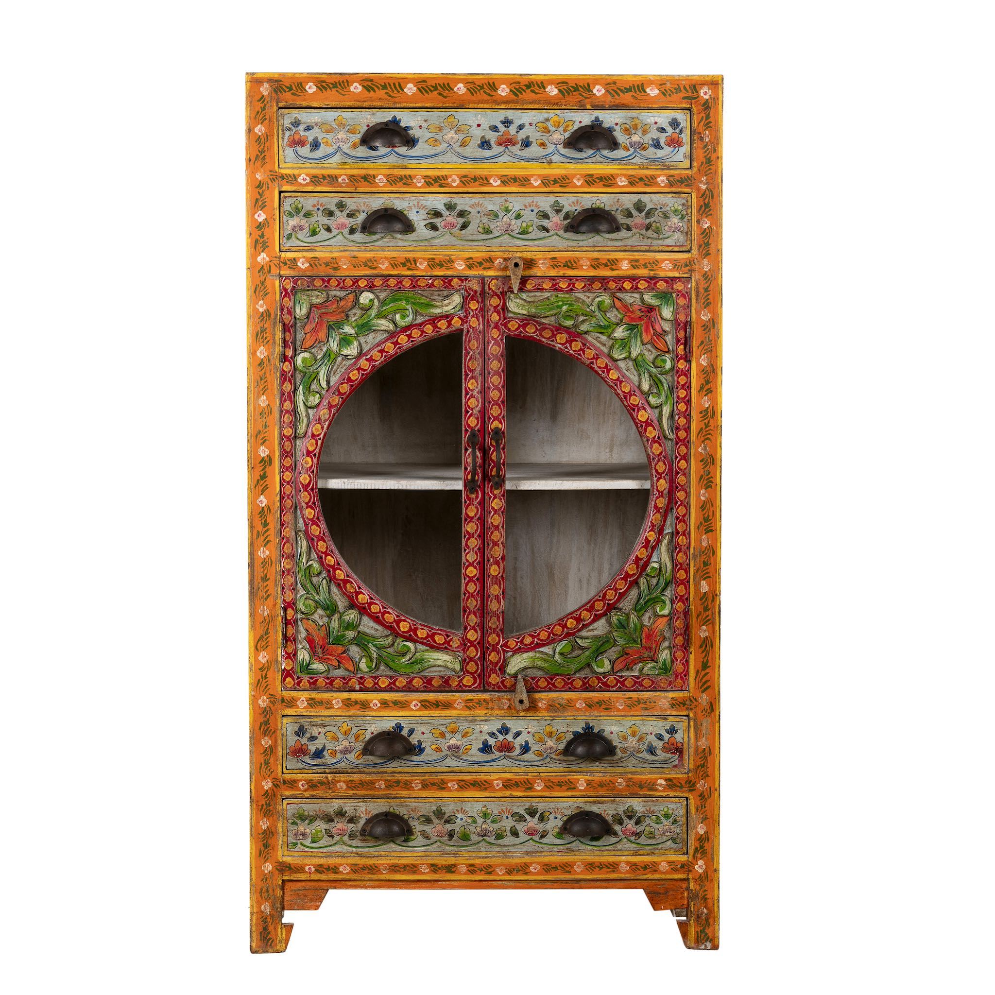 White background picture of a hand-painted showcase cabinet made from mango wood, featuring a circular glass-front display, floral motifs in rich orange, green, and red tones, and five drawers for added storage.